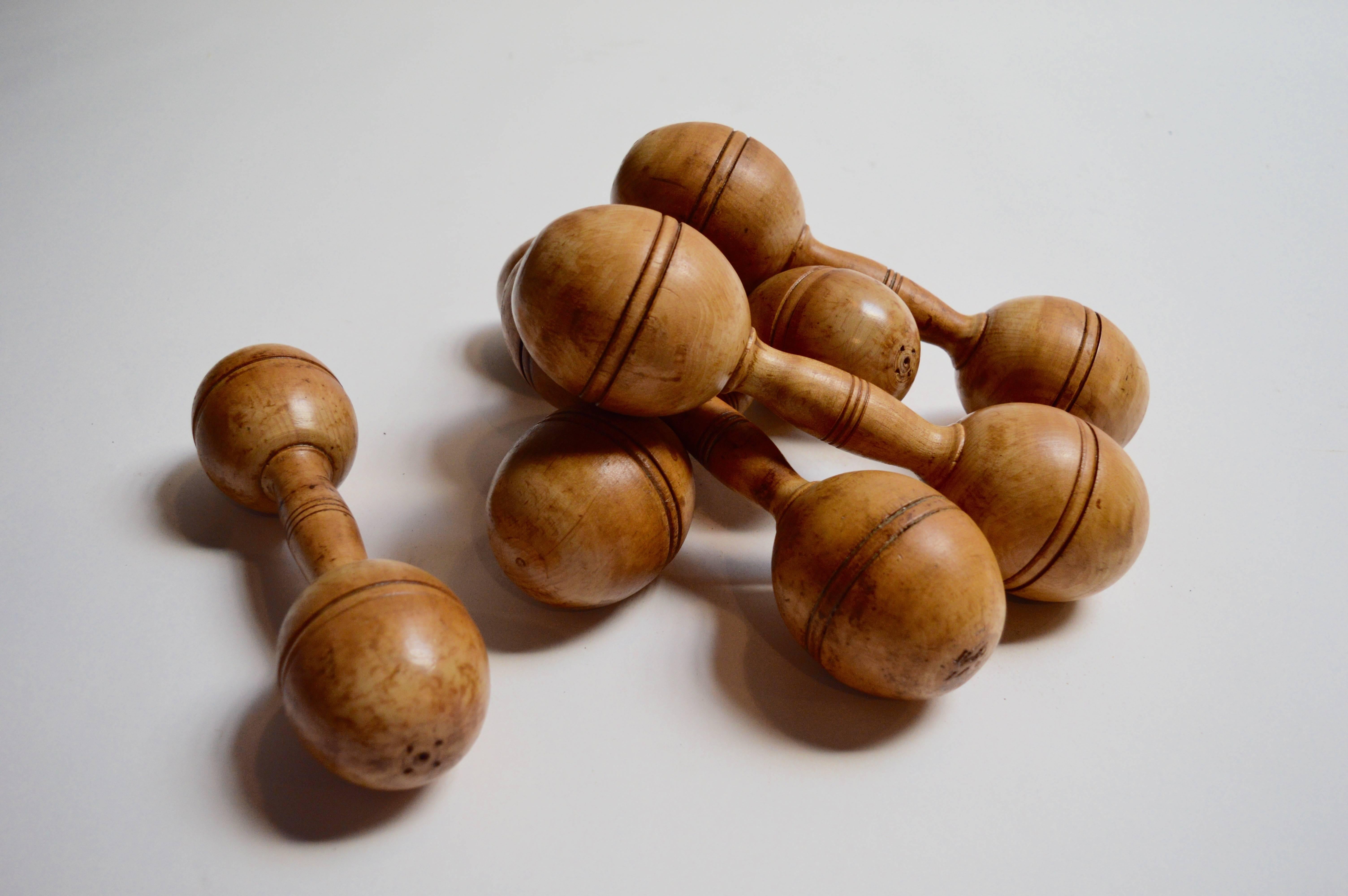 Great set of six vintage wooden dumbbells. Four larger 1.5 pound dumbbells and two smaller one pound dumbbells. Great decorative object for a coffee table or home gym. Excellent vintage condition.