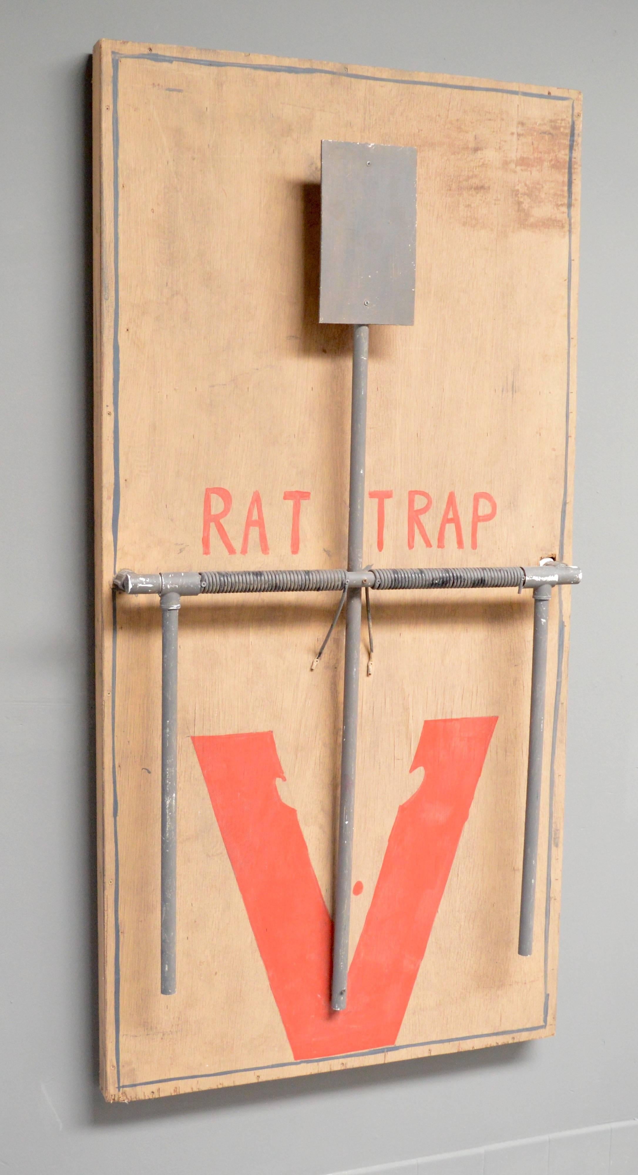 Fantastic Folk Art rat trap. Wood frame, with plastic with red paint. Possibly from a carnival. Very unique sculpture. Very good vintage condition.
 