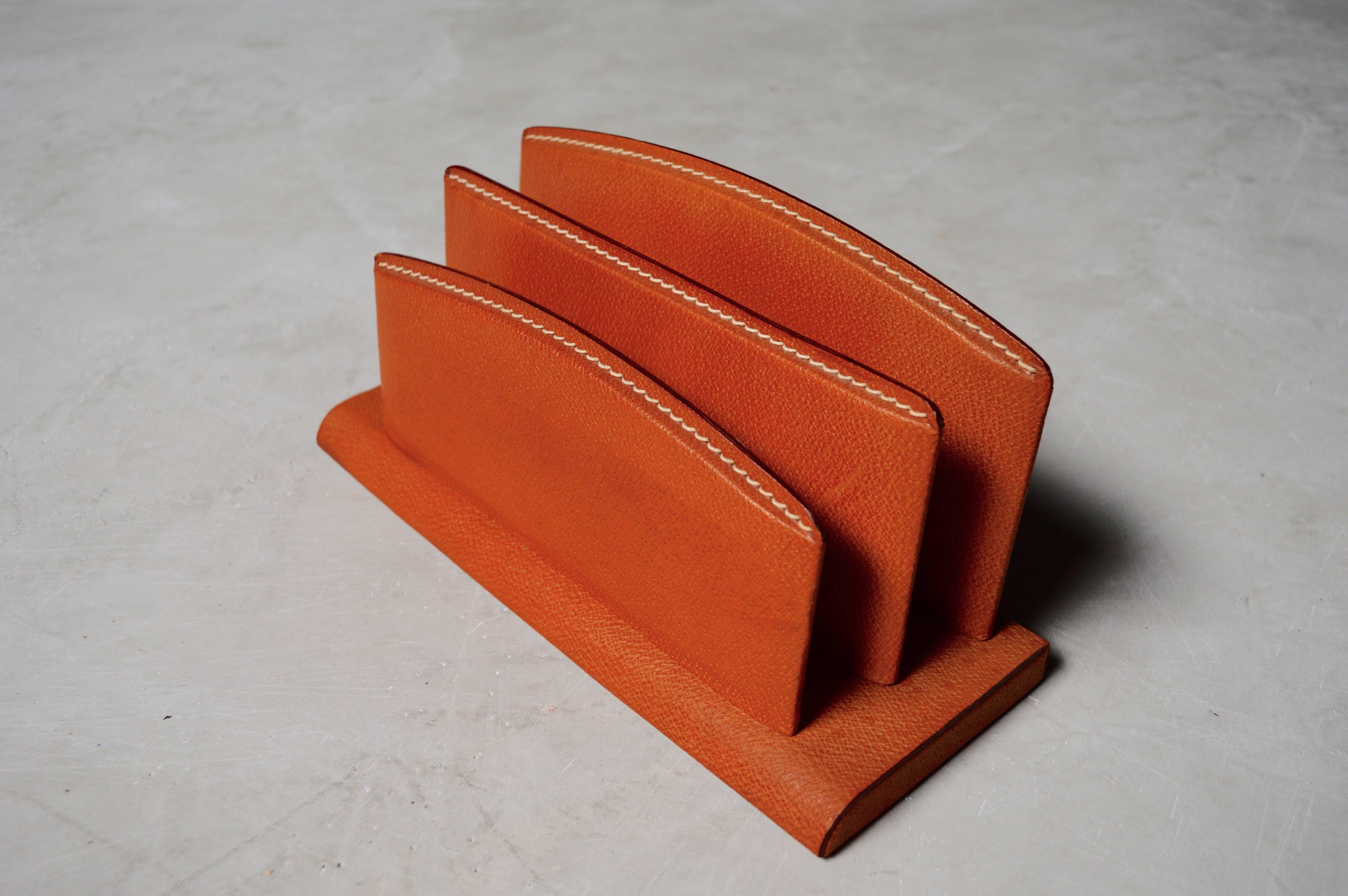 Handsome saddle leather letter holder by Jacques Adnet. Signature contrast stitching. Great patina to leather. Excellent vintage condition.