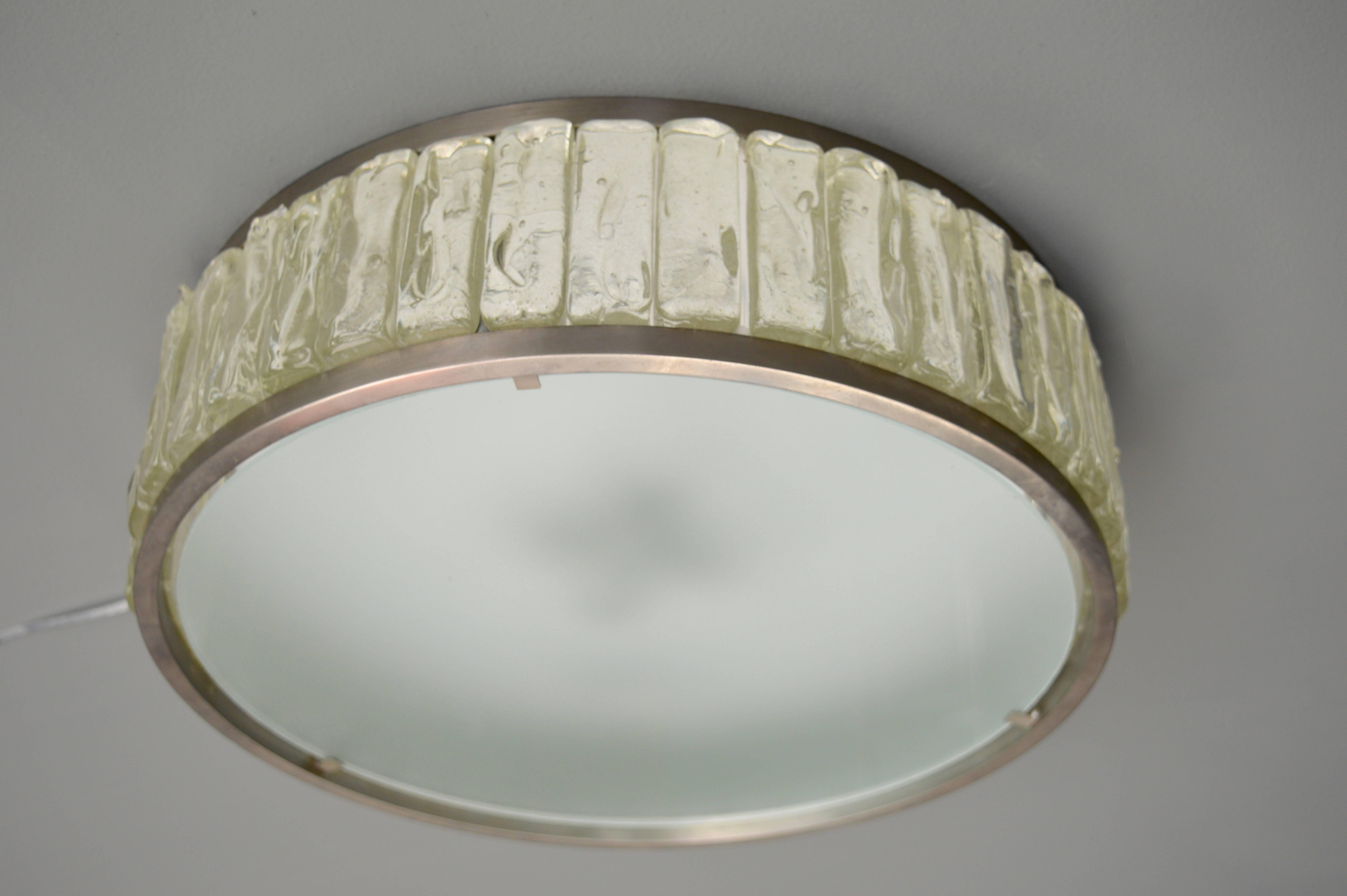 Exquisite vintage flush mount by Jean Perzel. Circular flush mount with nickel-plated brass hardware and milky glass diffuser. Rectangular ice glass blocks are sandwiched between two nickel discs. Newly rewired. Four European sockets. Excellent