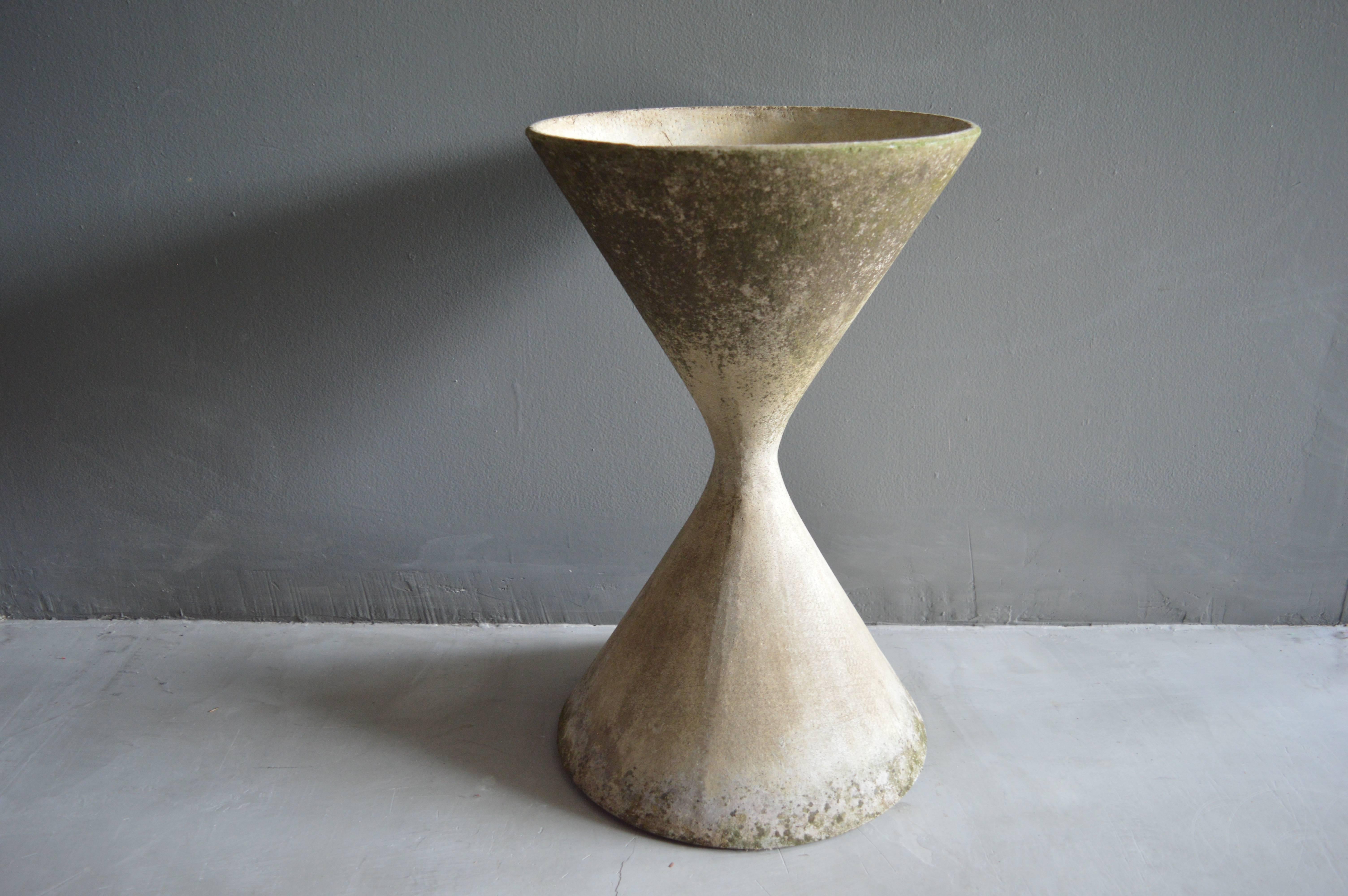 Classic hourglass planter by Swiss designer Willy Guhl for Eternit. Gorgeous patina to cement. Excellent vintage condition. Multiple pots available in this size.

Over a 150 Willy Guhl pieces available in our other listings.