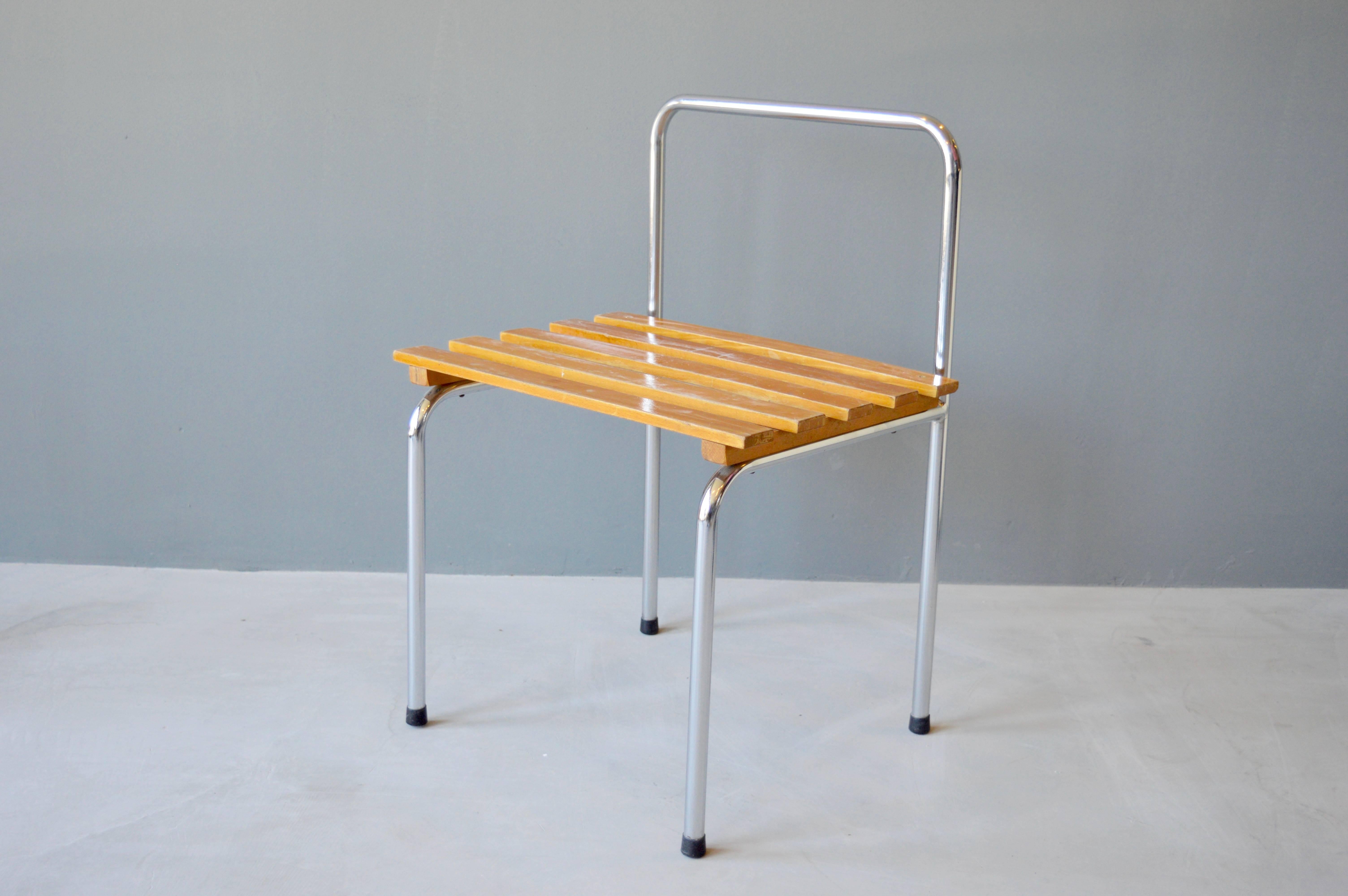 Classic luggage rack or stool by Charlotte Perriand for Les Arcs. Tubular chrome frame with pine slats. Wood in original vintage condition. Could also be used as a side table. Fantastic piece of design. 8 available. Varying degrees of patina. Priced