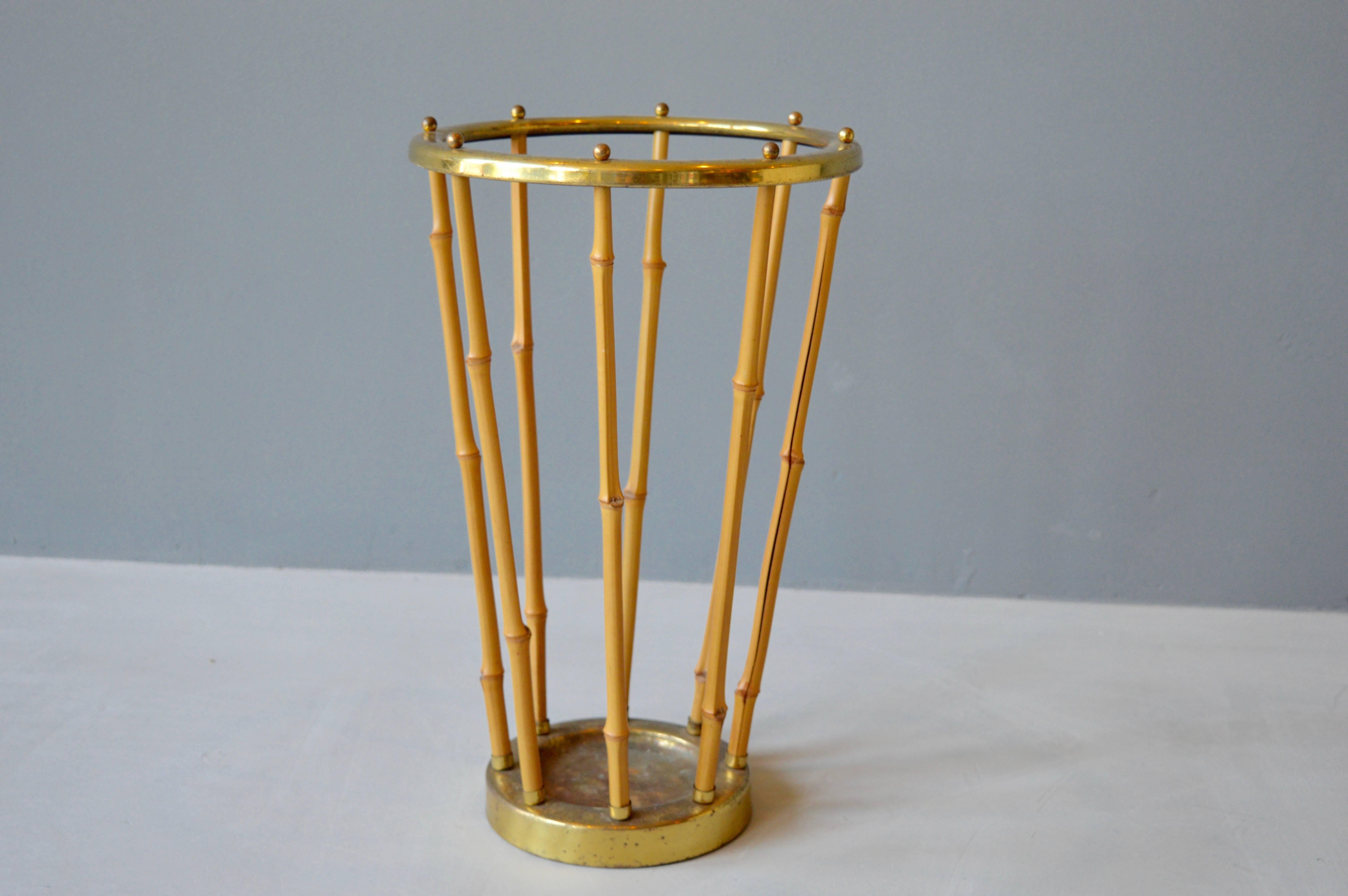 Handsome French umbrella stand made of brass and bamboo. Great original patina to brass. Very good vintage condition.
