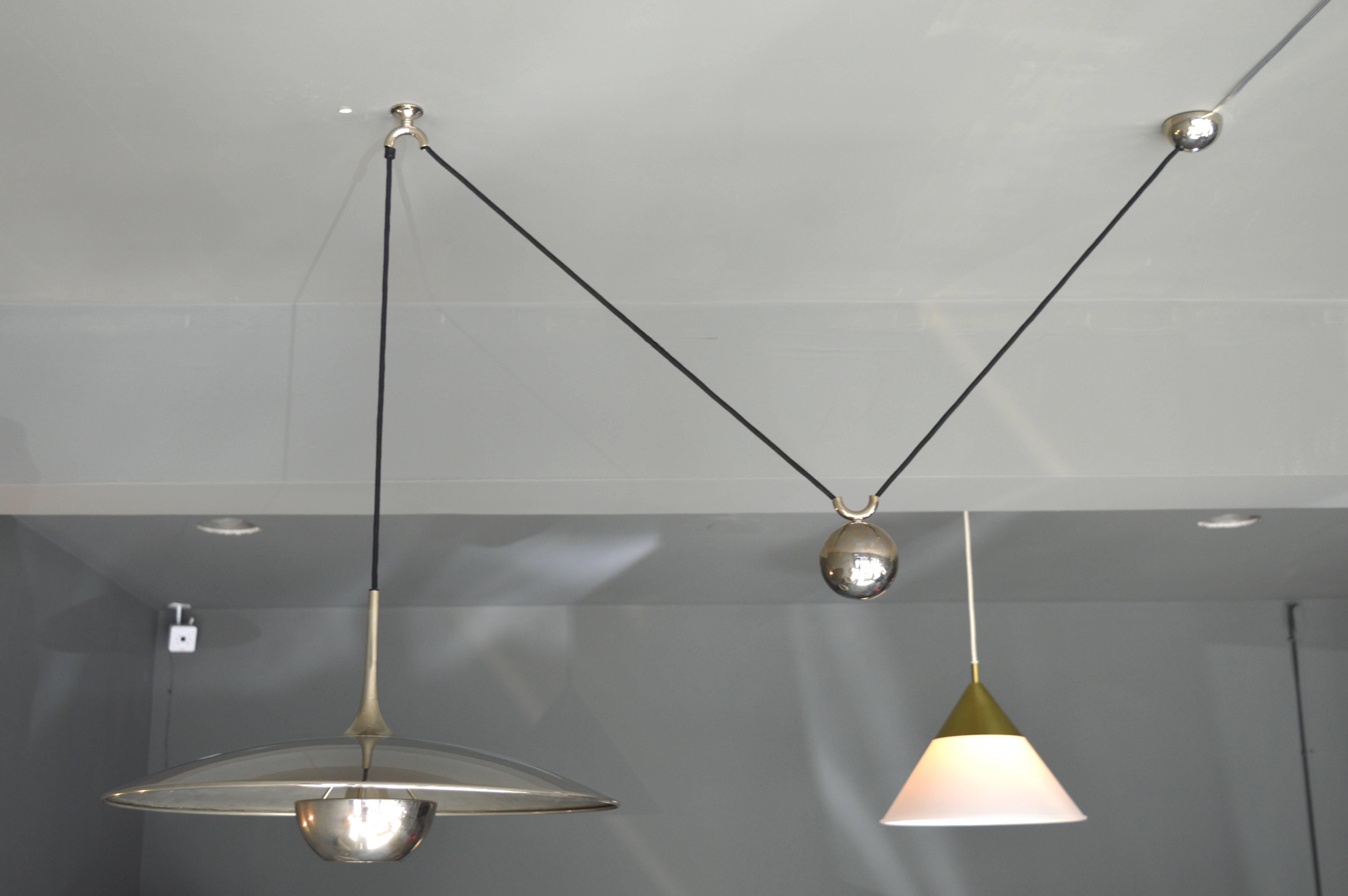 Handsome counter balance pendant by German design house Florian Schulz. Nickel hardware includes, diffuser, canopy and counter weight. Beautiful design. Looks great on and off. Overall height is adjustable from 15