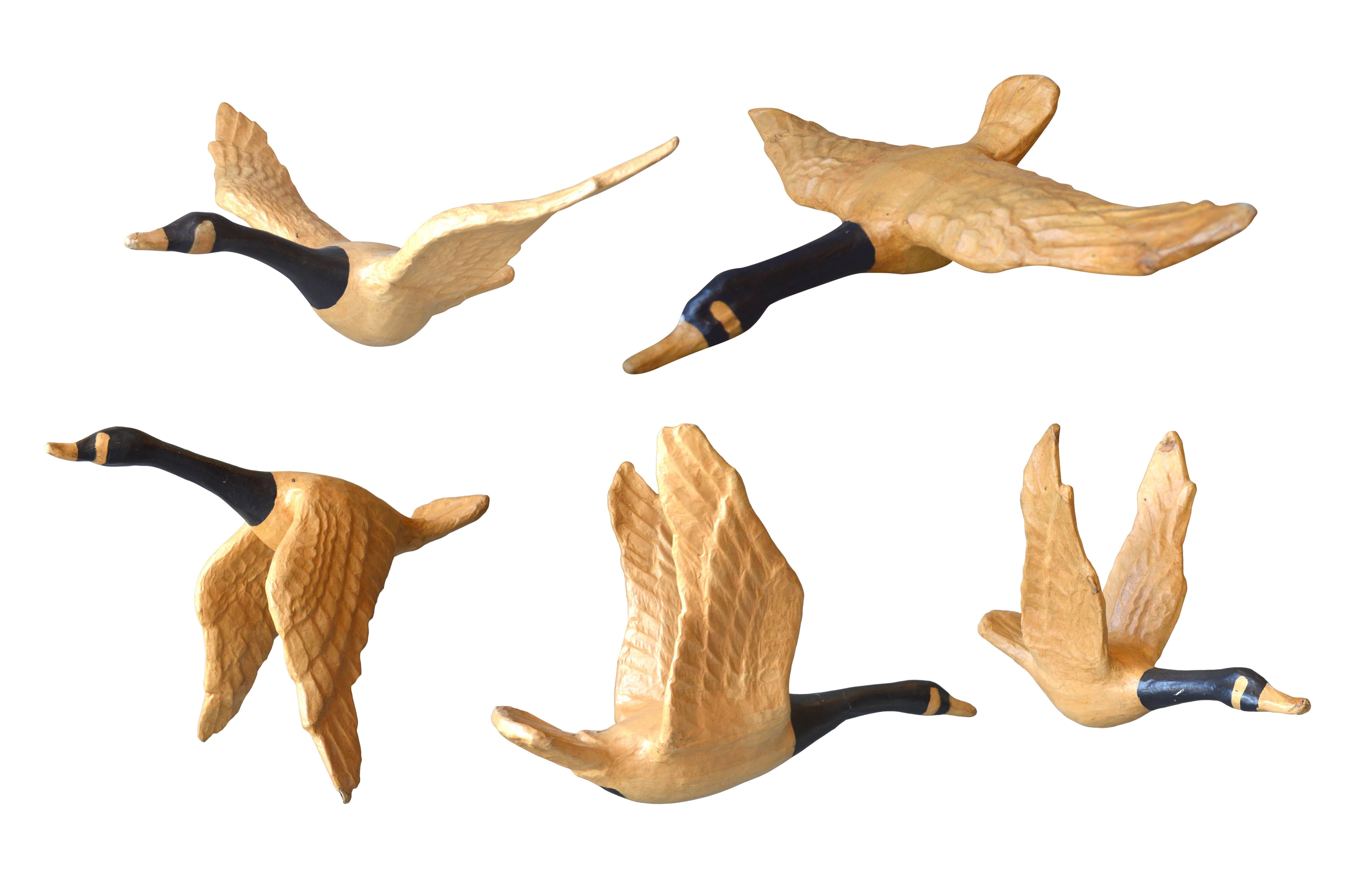 Unique set of five papier mâché geese. Ranging in size from 16
