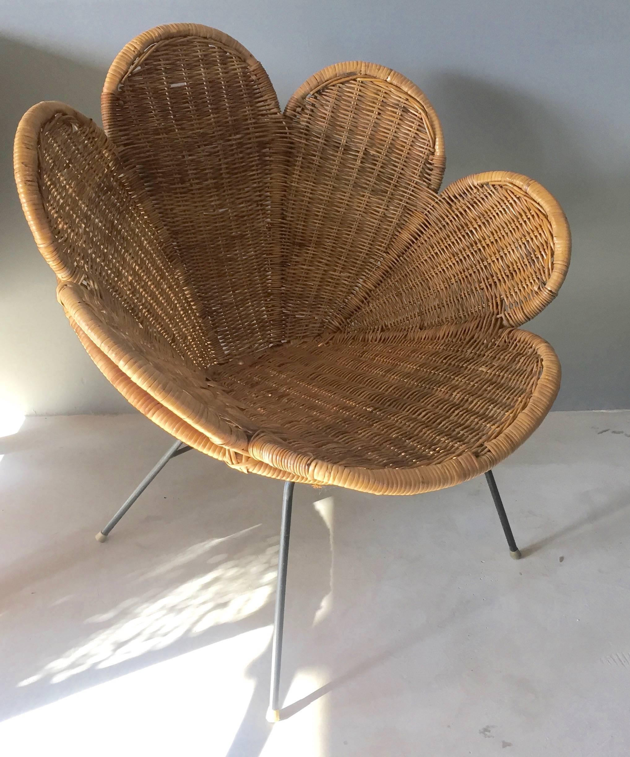 Stunning rattan and iron chair in the shape of a flower. Excellent vintage condition. Great standalone sculptural chair.