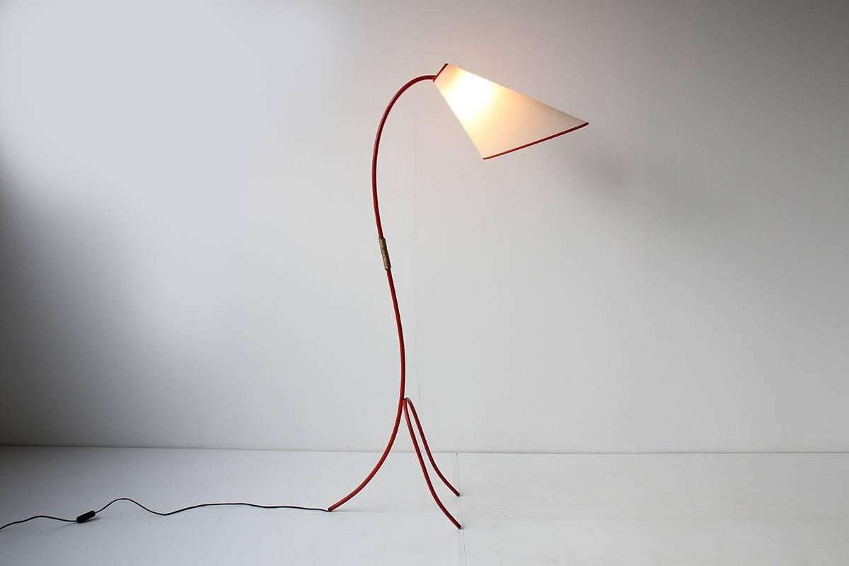 Elegant Italian floor lamp made of iron. Great patina to red paint on iron. Newly rewired. New paper shade with red trim. Excellent vintage condition. Gorgeous piece!