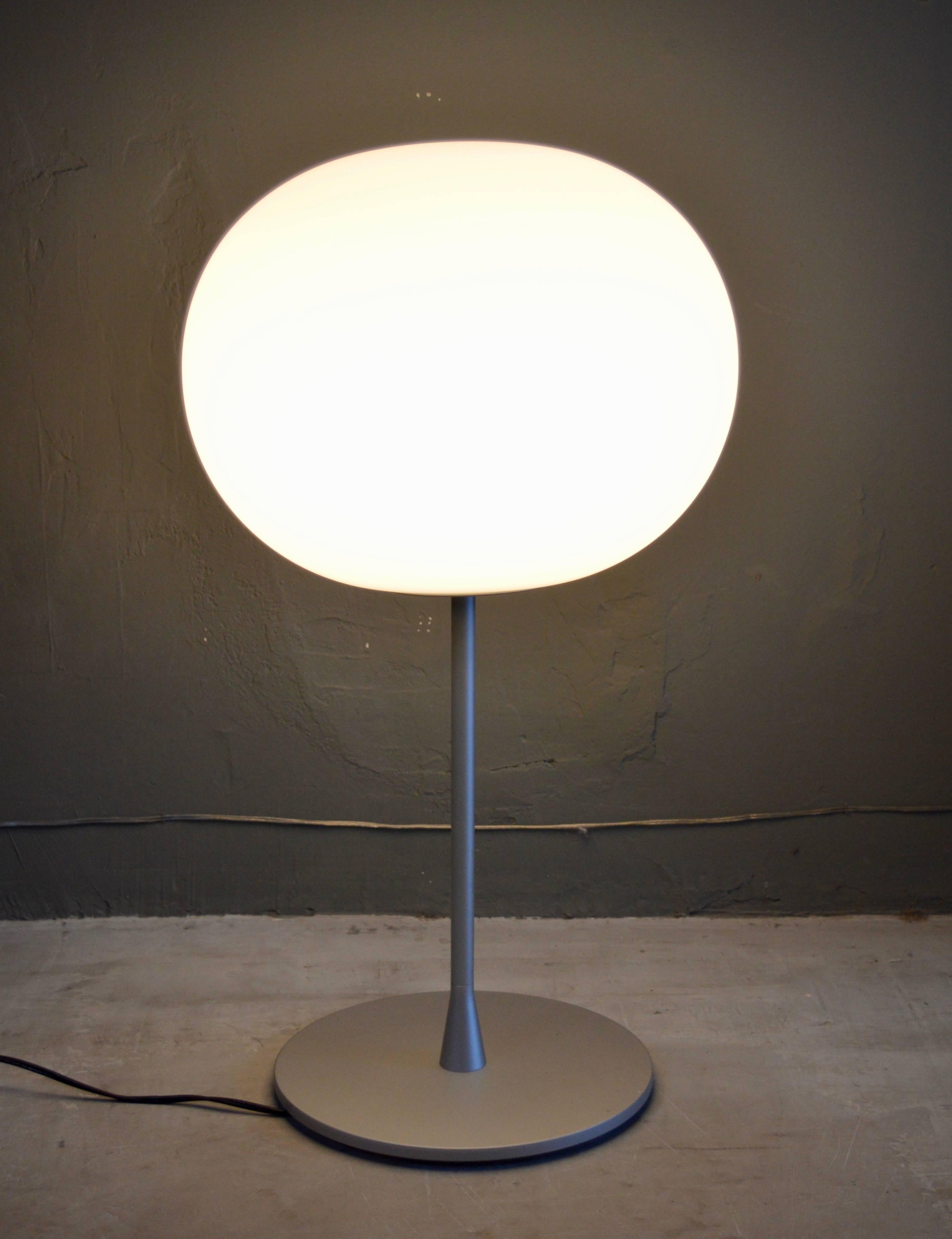 Classic floor lamp by Jasper Morrison for Flos. Massive glass ball atop a brushed nickel base. Dimmable switch. Excellent vintage condition. Matching large floor lamp available in separate listing. 

Diameter of globe is 17.75
