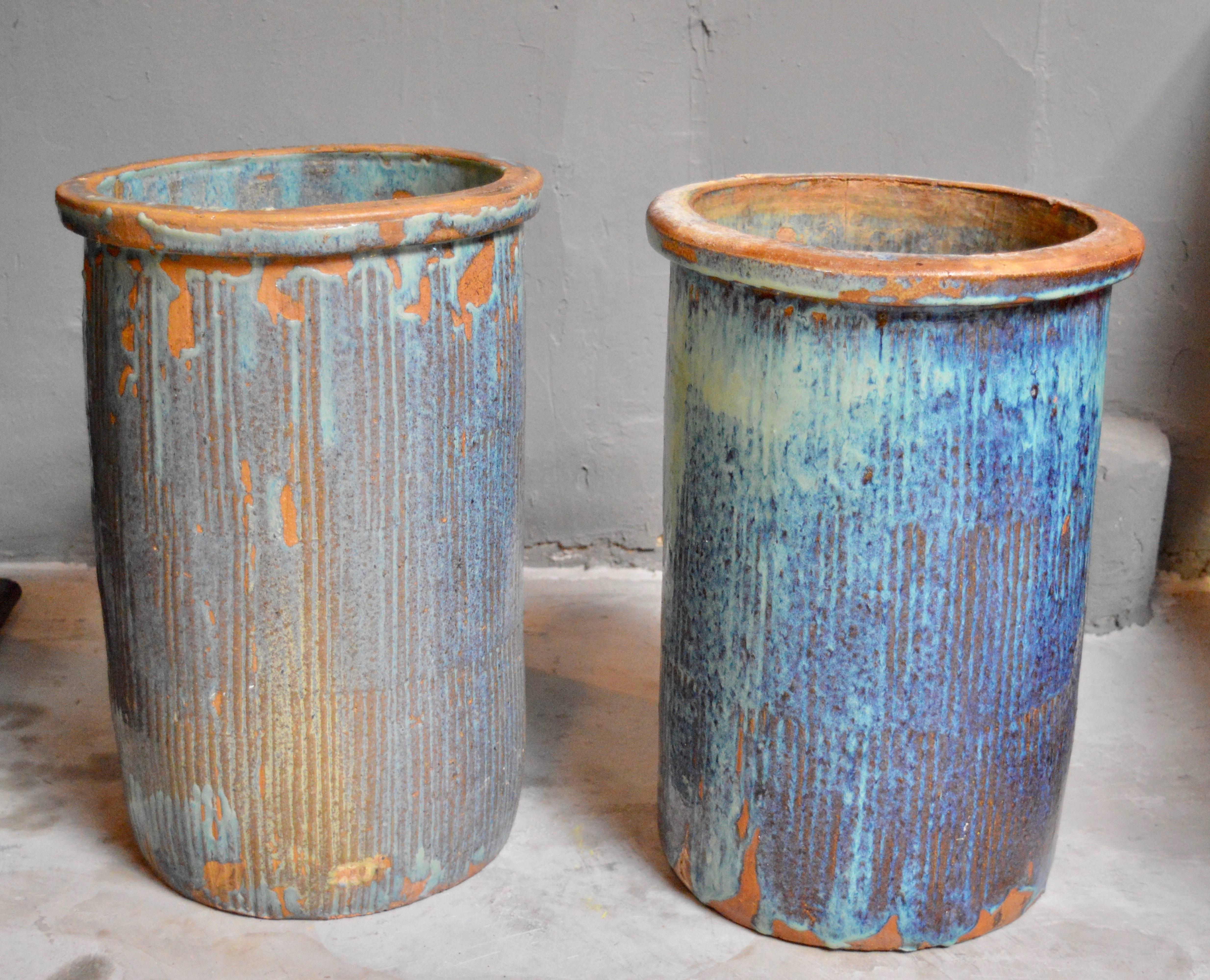 Fantastic pair of large drip glaze ceramic pots. Great blue coloring. Good vintage condition. Perfect for indoors or outside.