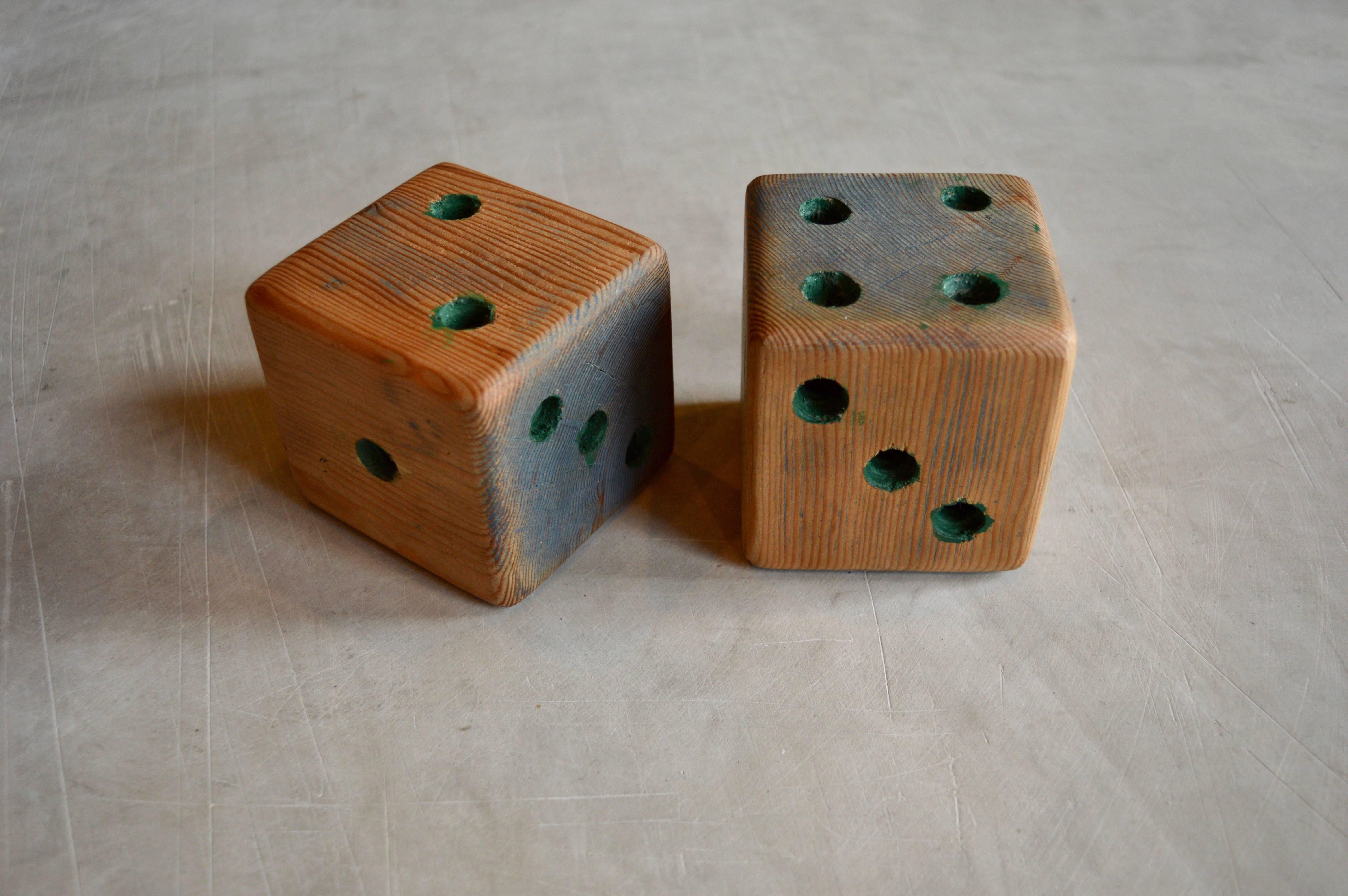 Great pair of handmade Folk Art wood dice. Green coloring inside the holes and on a few random sides. Interesting tabletop sculpture.