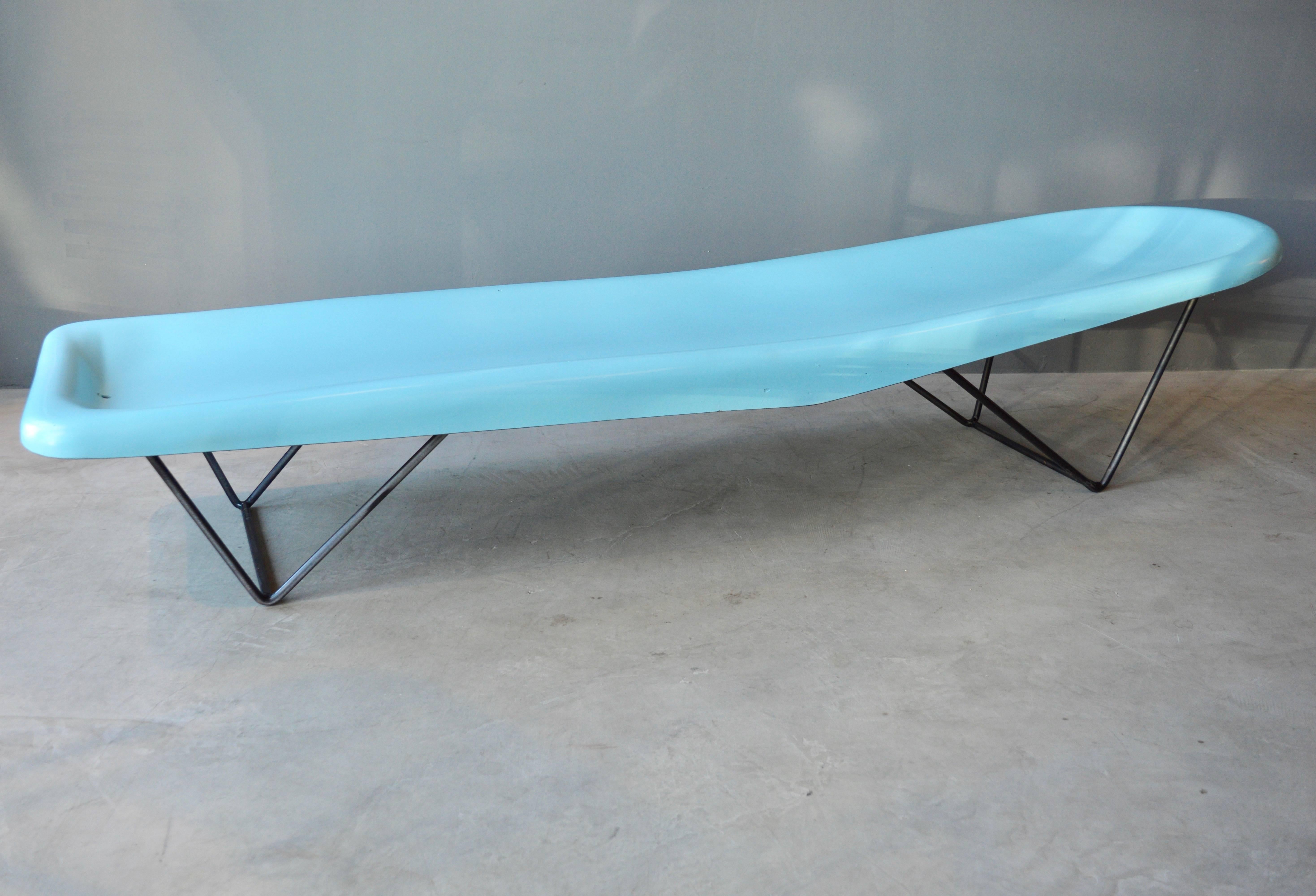 Stunning time capsule of two aqua colored, fiberglass lounge chairs by Fibrella. Made in the 1950s. Perfect for a Mid-Century poolside. Architectural iron base. Excellent vintage condition. Original blue color. $600 to have chairs repainted in color