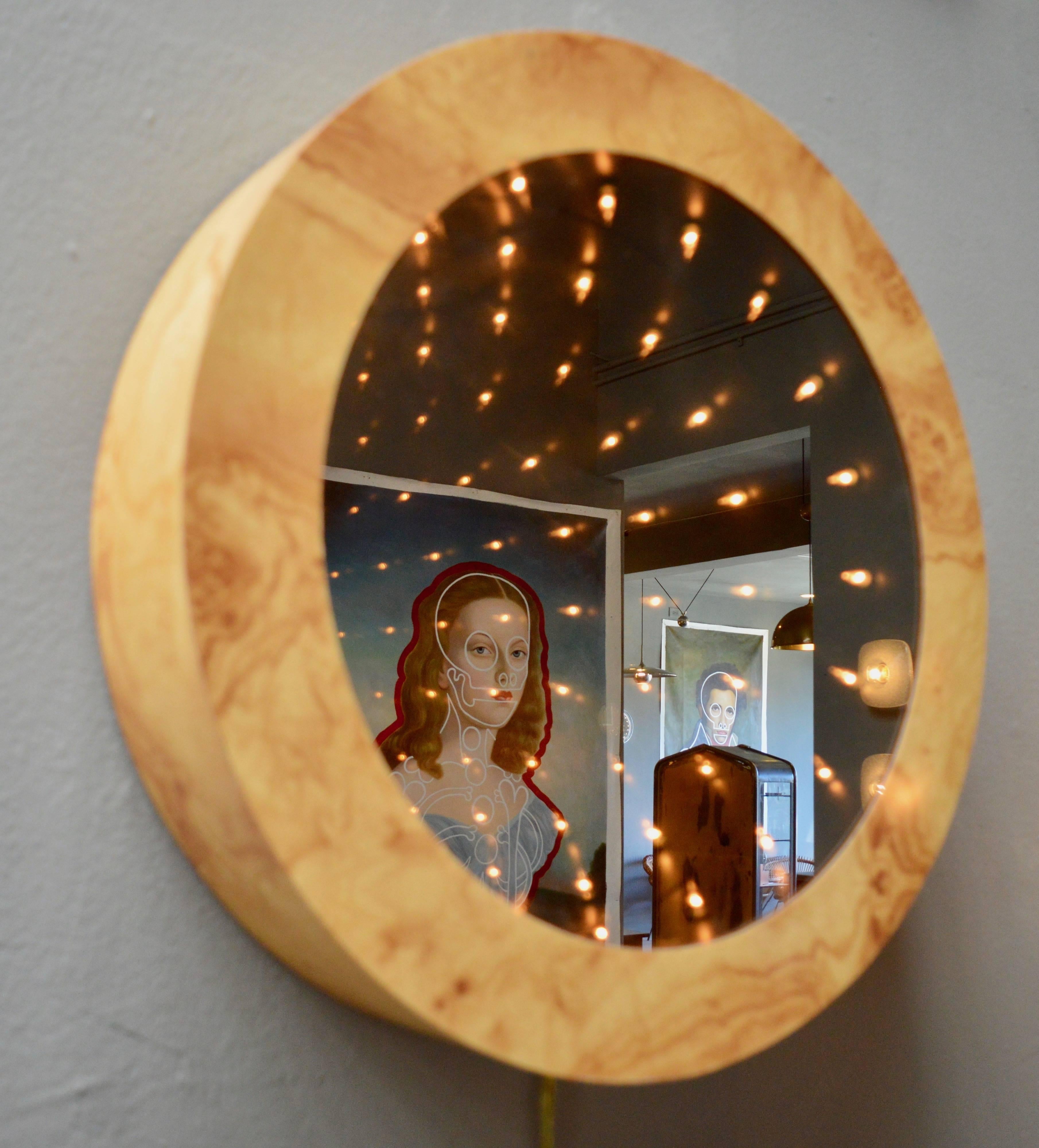 Stunning vintage burl wood infinity mirror. Dark mirrored glass with burl wood frame. Newly rewired with black cloth cord. Excellent vintage condition. Great piece of art!