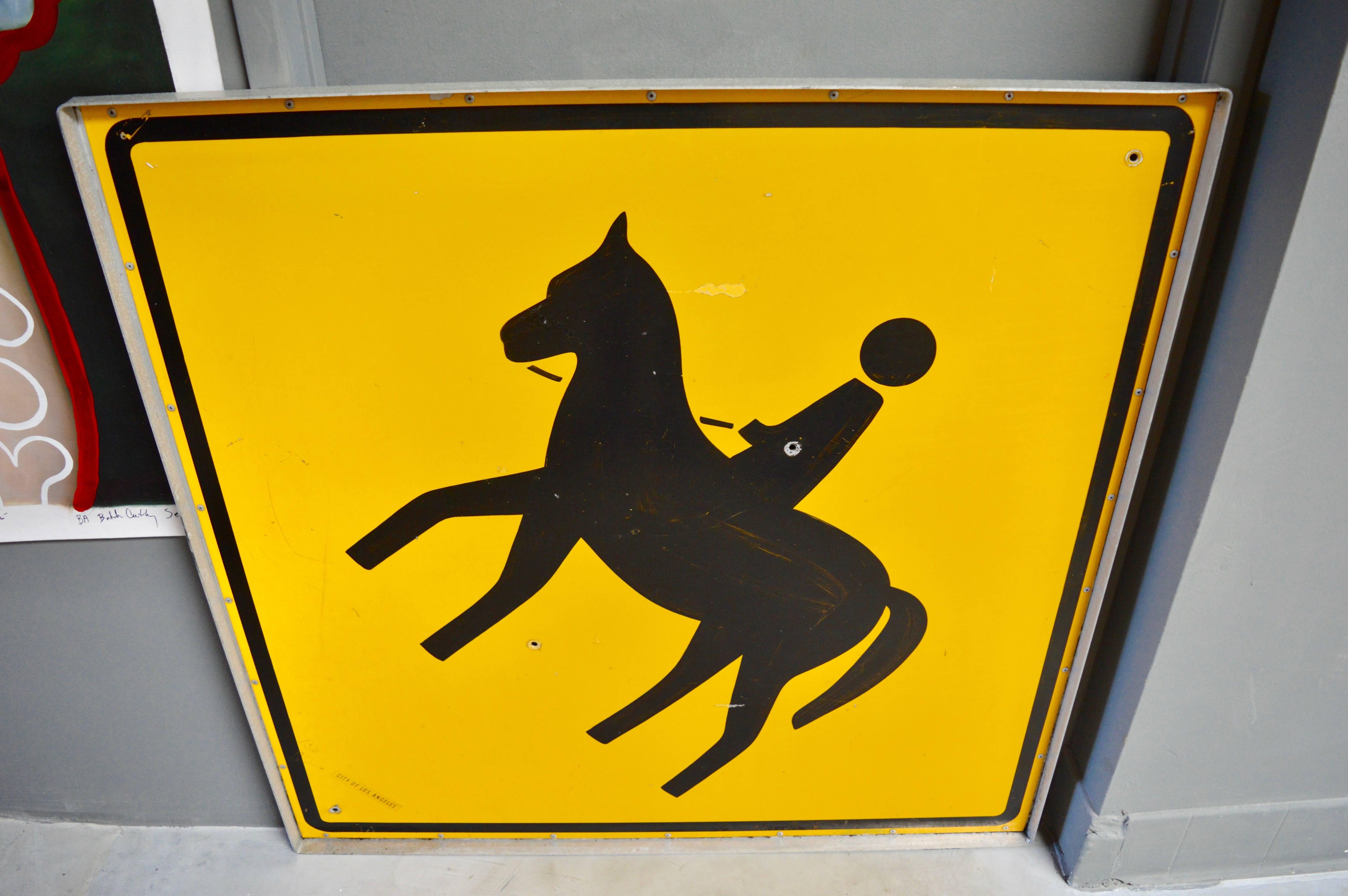 horse crossing road sign