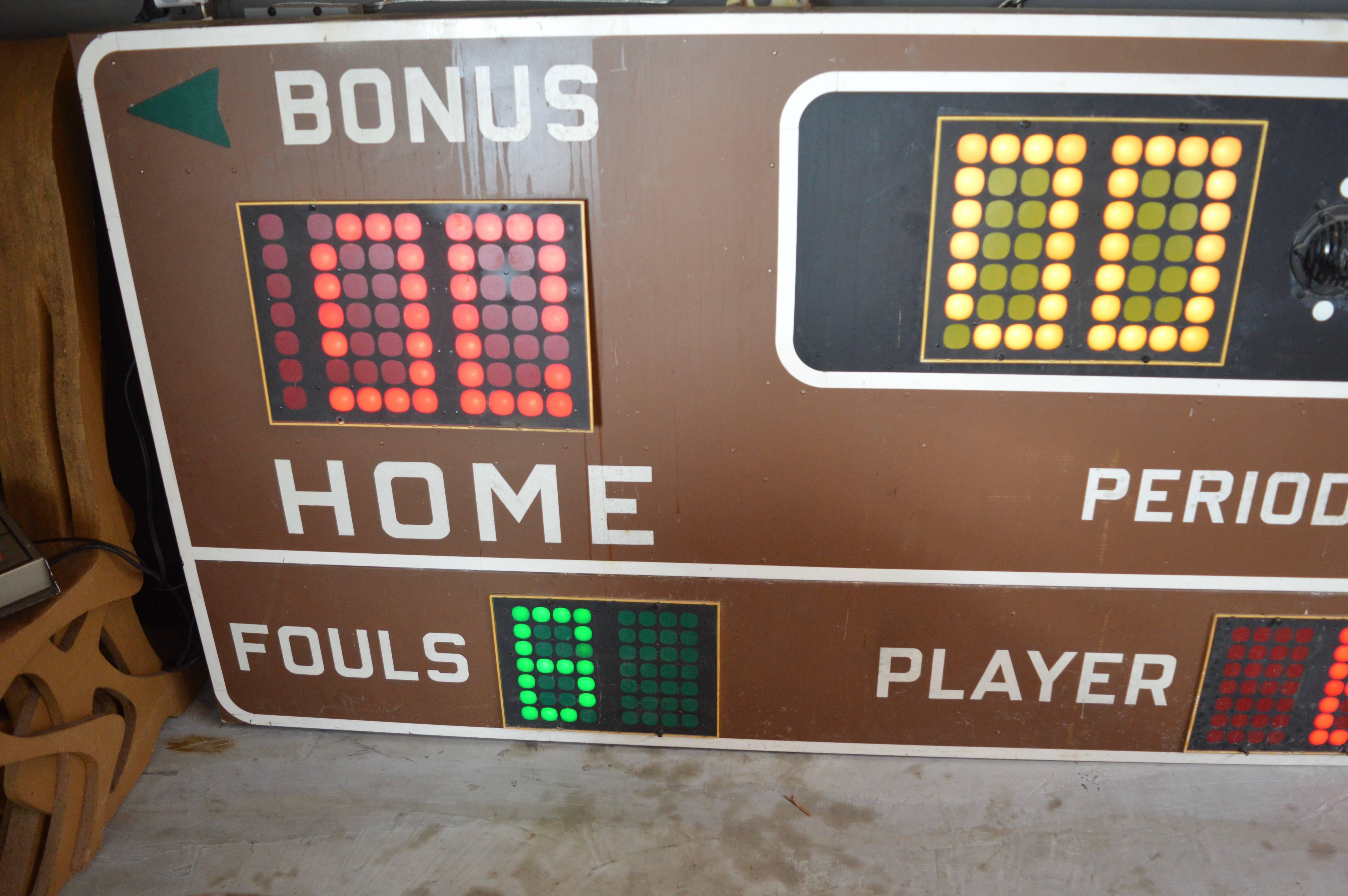 Massive 12 foot long vintage basketball scoreboard by Fair Play in the 1970s. In great working order with controller to adjust score, running shot clock etc. Working Horn. Very fun piece of art for your home or commercial space. Taken down from a