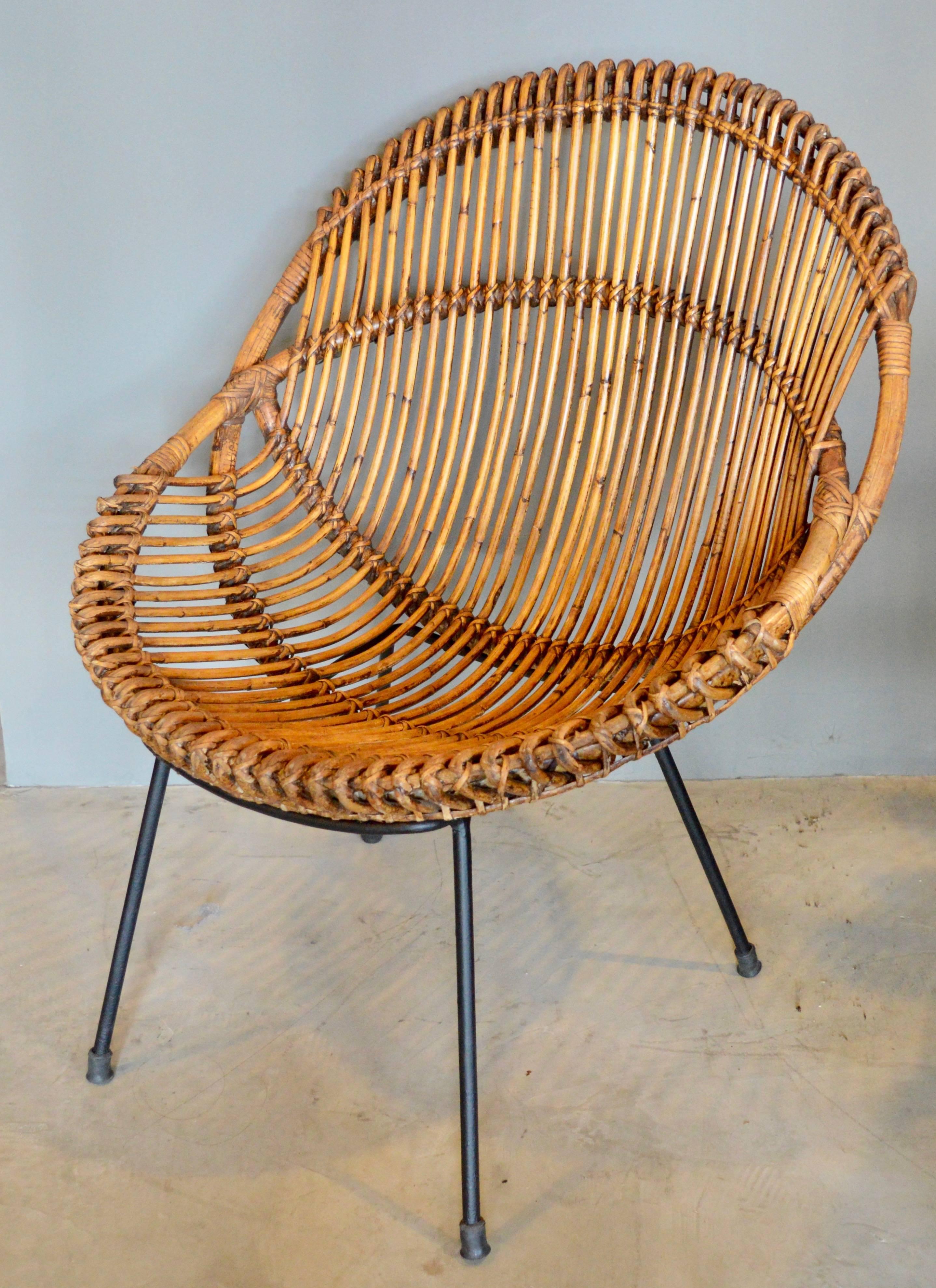 Fantastic French rattan, bamboo and iron scoop chair. Great patina and age to rattan. Chairs in excellent vintage condition. Perfect for indoors or outside.