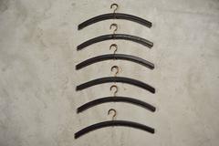 Jacques Adnet Set of Six Leather and Brass Hangers