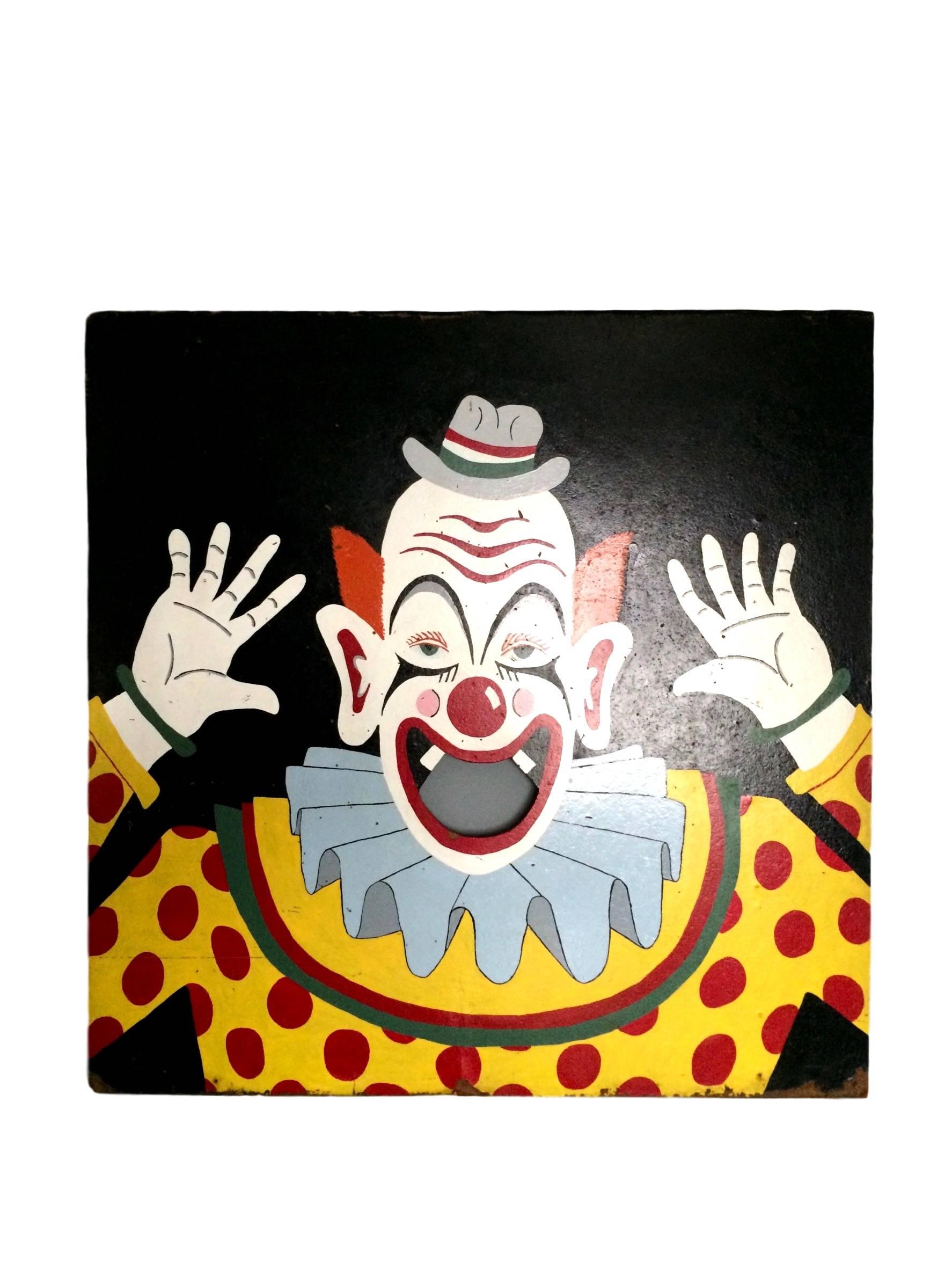 Great vintage board from an old carnival. Large hand-painted board depicting a clown with an open mouth. Bean bags were probably used to throw inside. Great piece of wall art with fantastic colors.