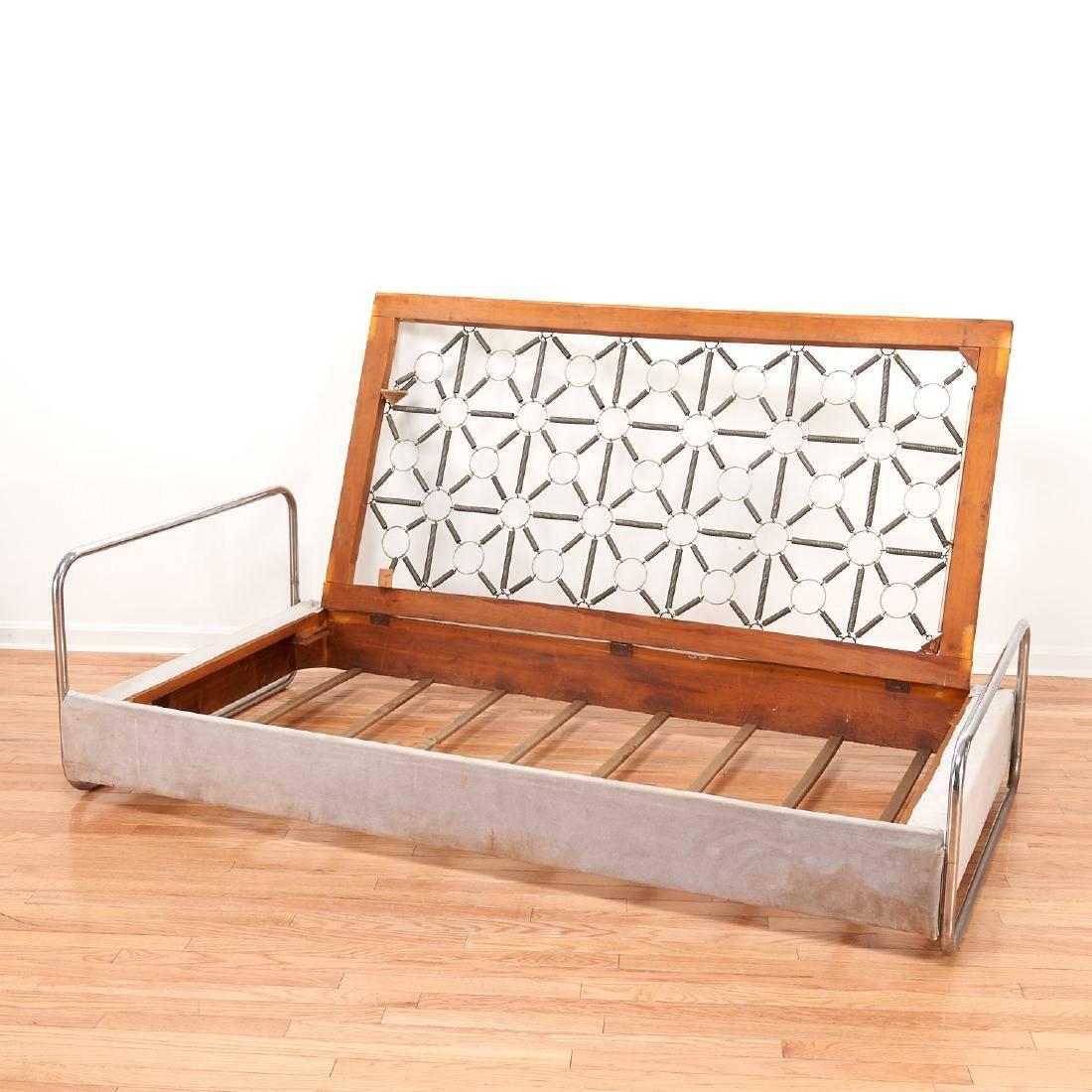 Amazing Marcel Breuer style daybed. Tubular chrome at both ends. Bed has hinges which allow it to be lifted, allowing for storage underneath. Great piece of design. Fantastic spring design. Fabric is original but can be replaced for small fee.