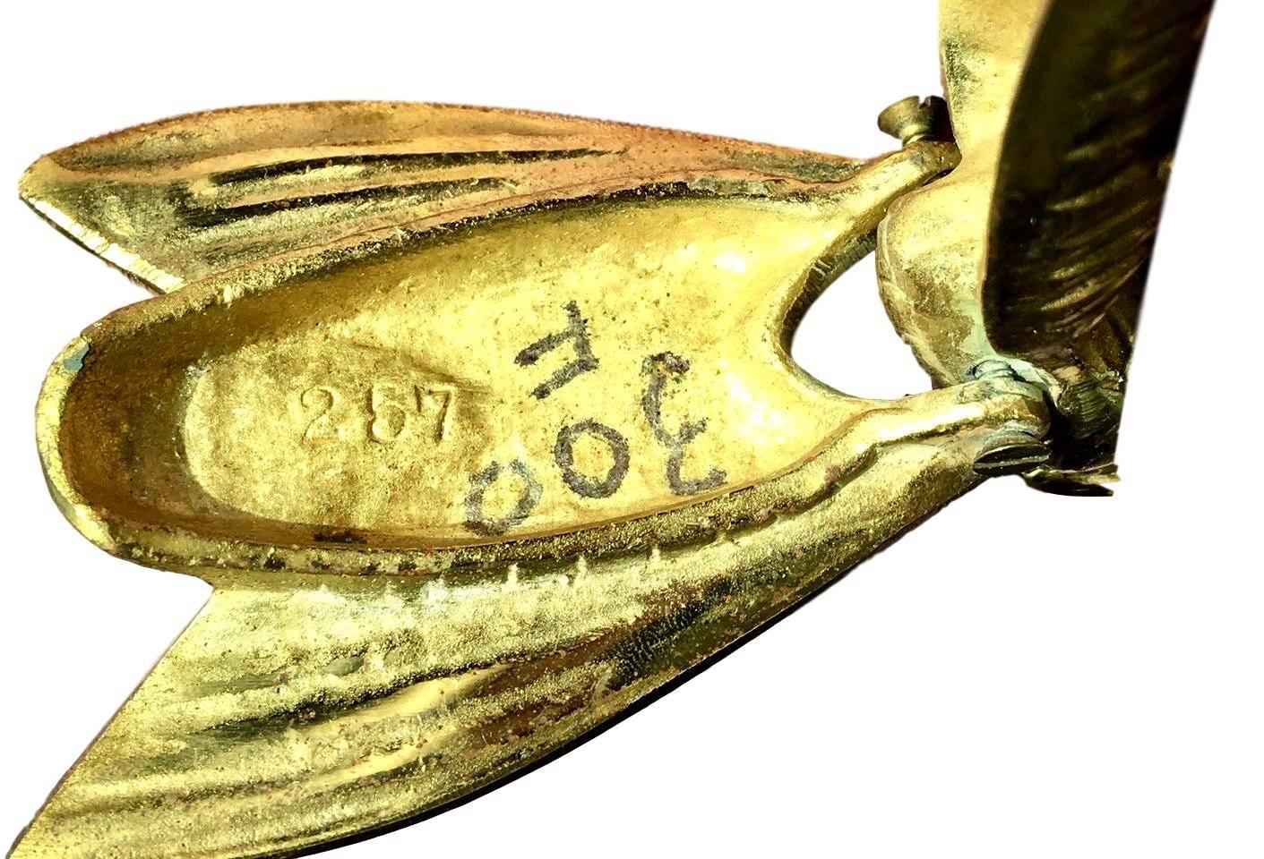 brass fly ashtray history