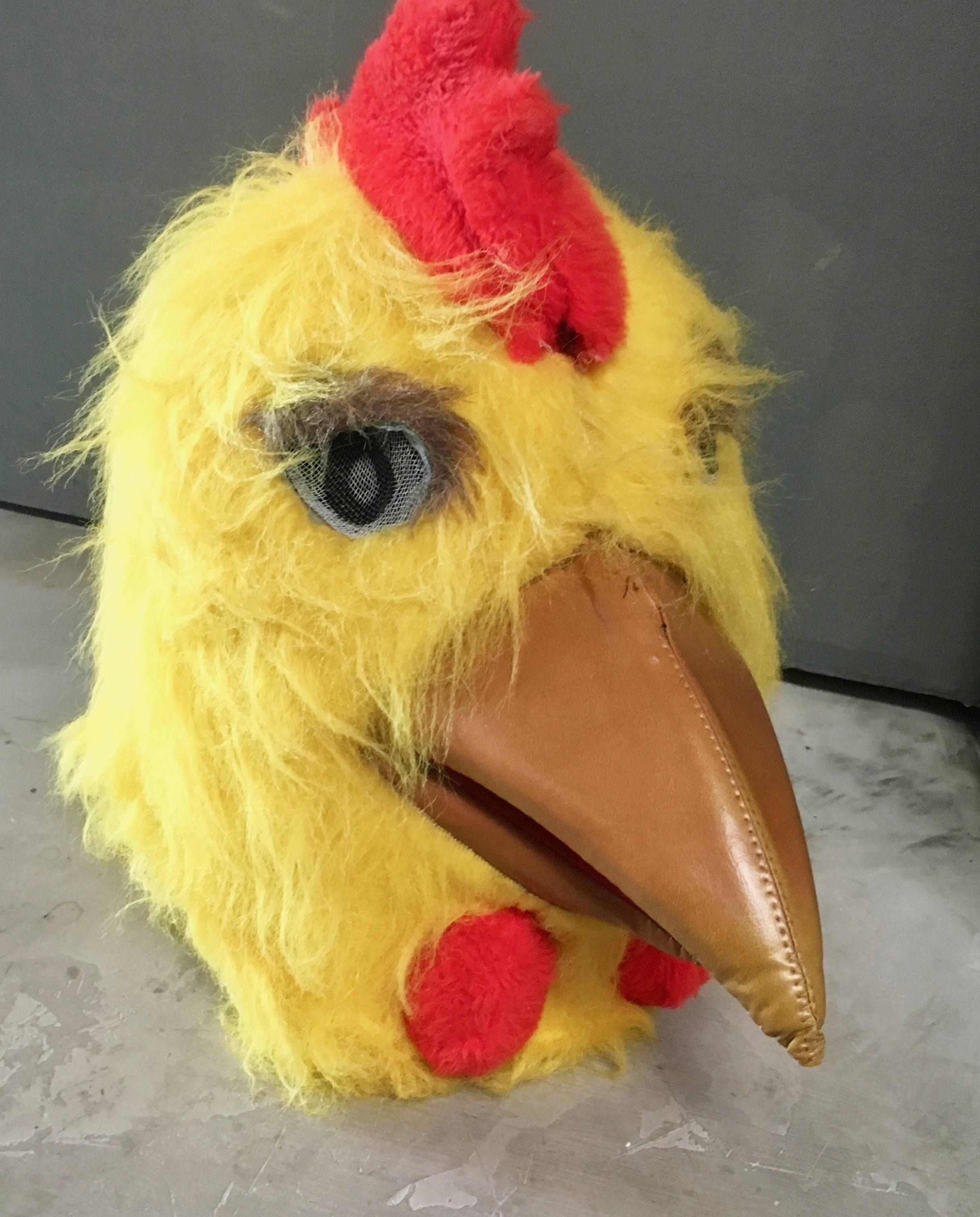 Great Folk Art chicken head mask. Leather beak. Mesh eyes. Great coloring. Fun object and wearable piece of art.