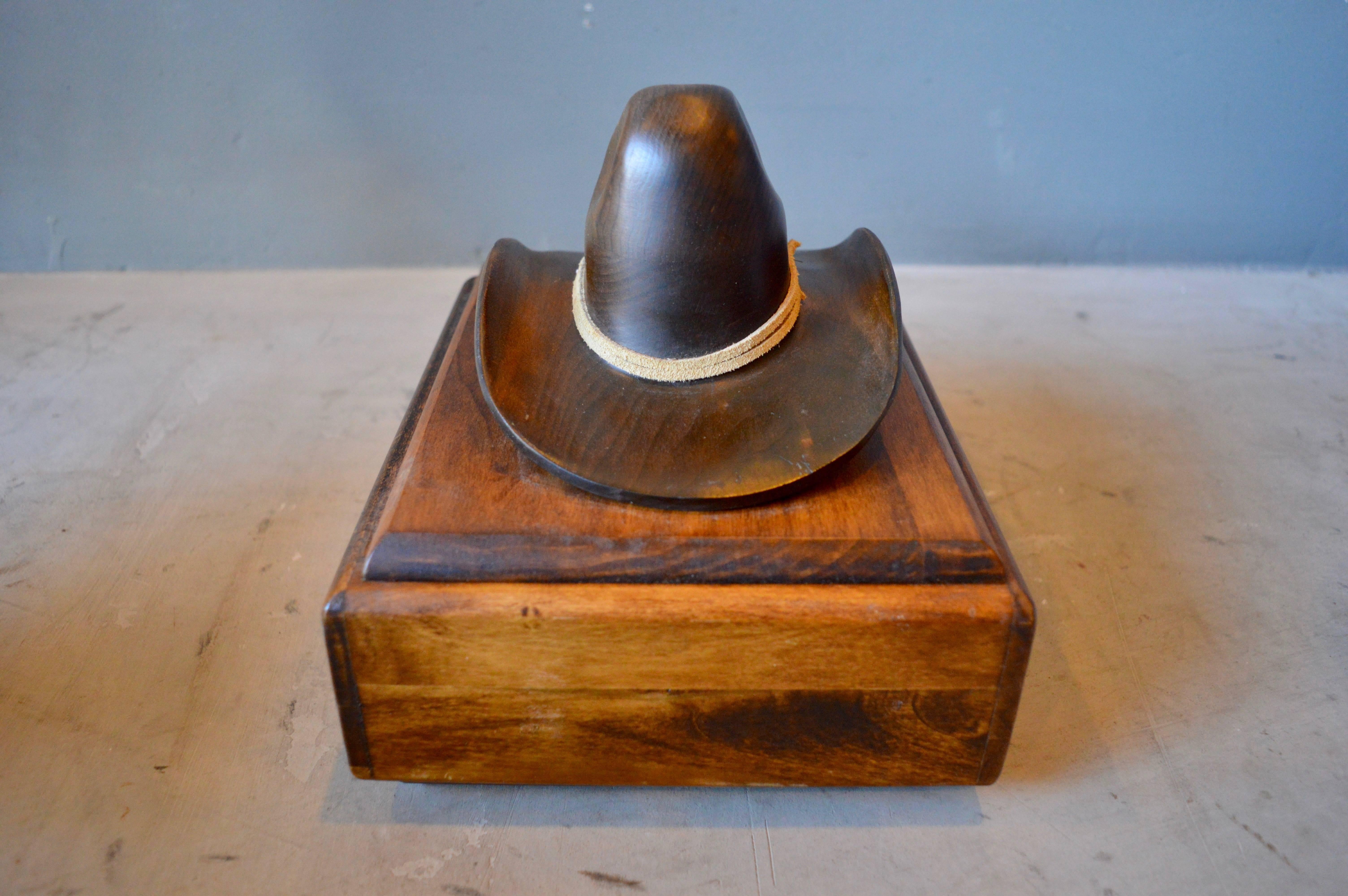 Cool hand-carved wood box with a cowboy hat lid. Fantastic piece of Folk Art. Excellent workmanship. Signed 1981 underneath lid. Great tabletop box and functional sculpture. Excellent condition.