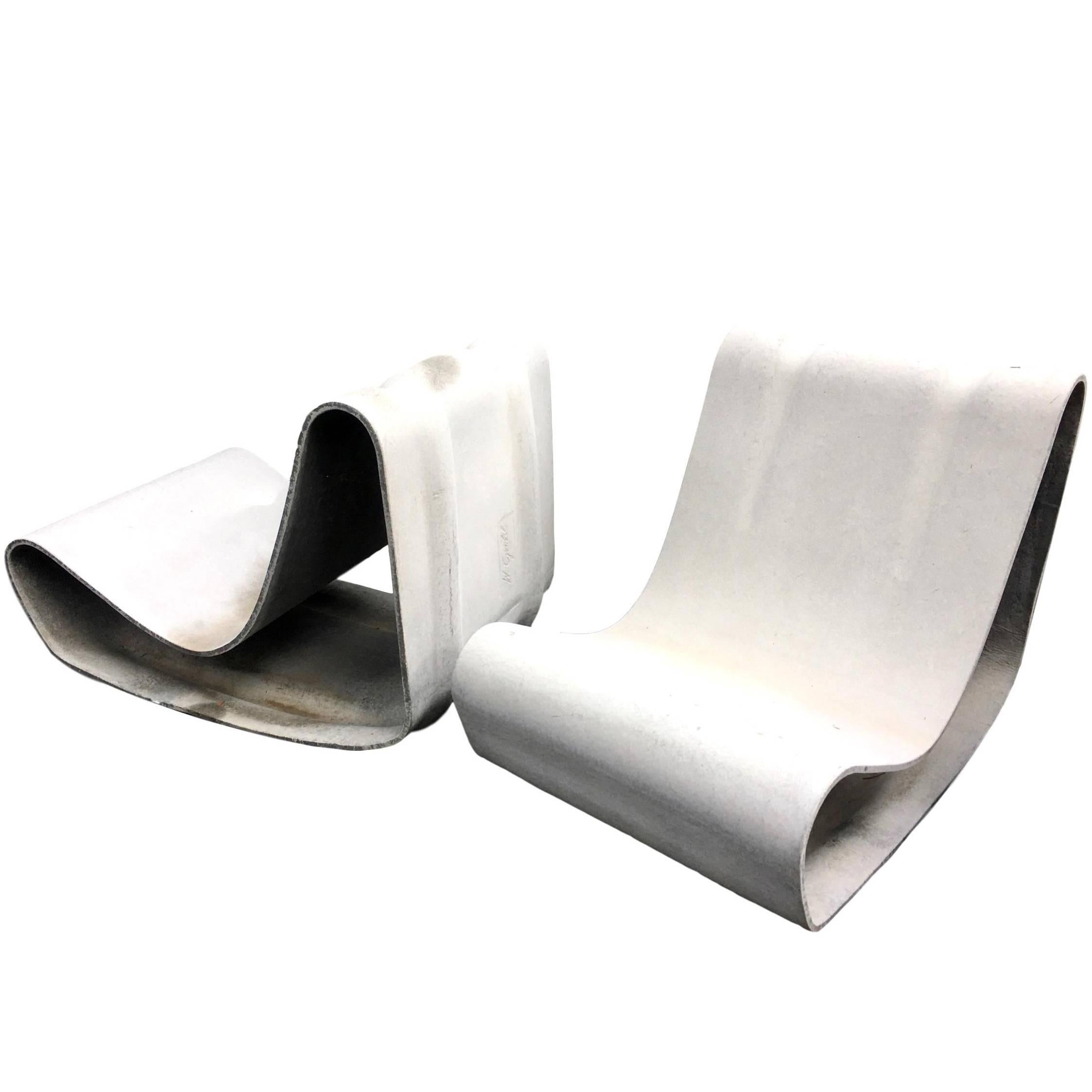 Fantastic pair of cement chairs with matching table by Swiss designer Willy Guhl for Eternit. One of the most iconic chairs ever designed. Excellent condition. Priced as a set of two chairs and table. 


      