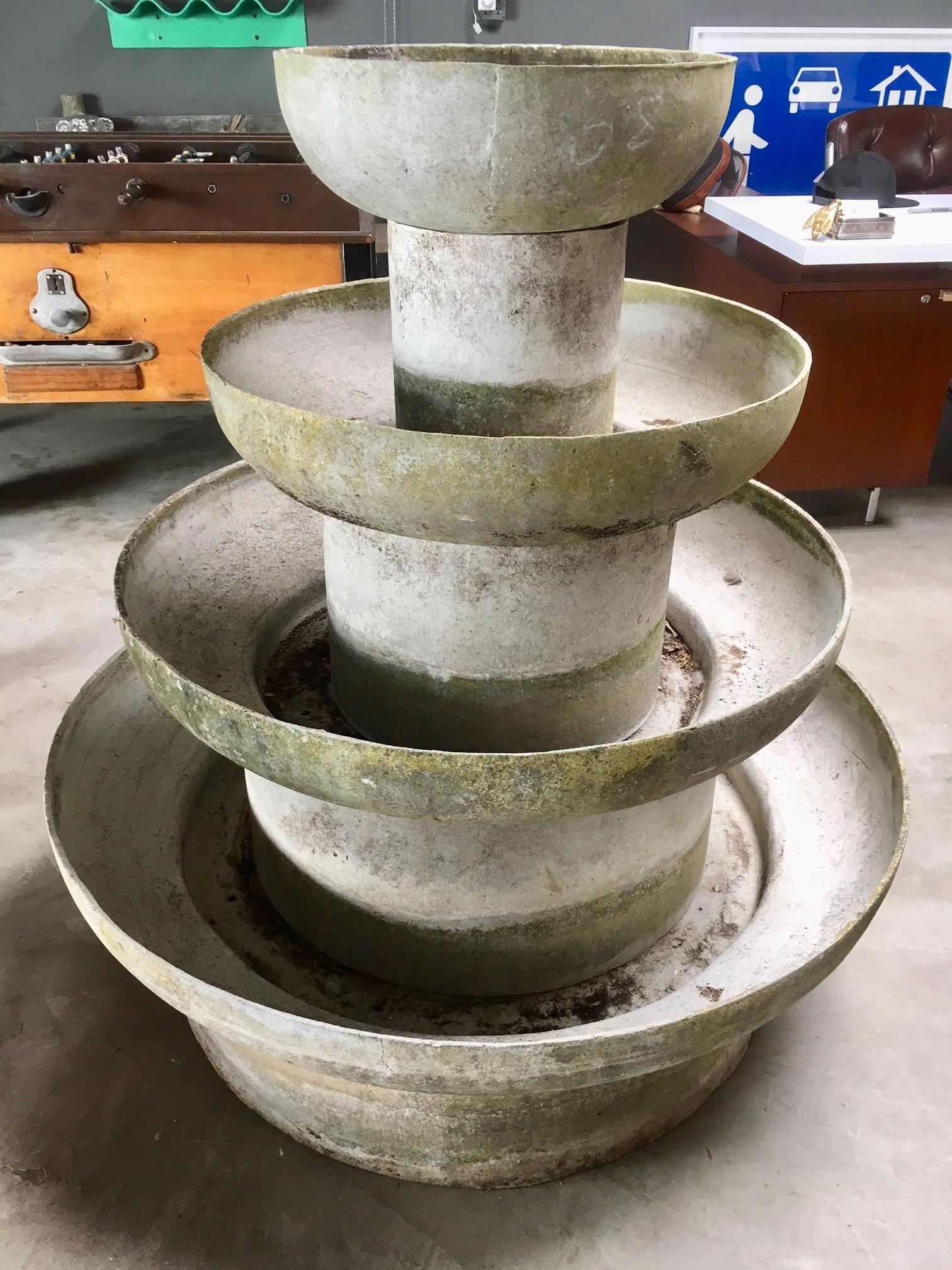 Rare concrete fountain by Willy Guhl for Eternit. Fabricated out of cement. Only fountain known to exist. Great sculpture and object. Four tiers. Just under 4 feet tall. Four circular bases  with 4 rounded bowls atop each base. Bases are hollow.