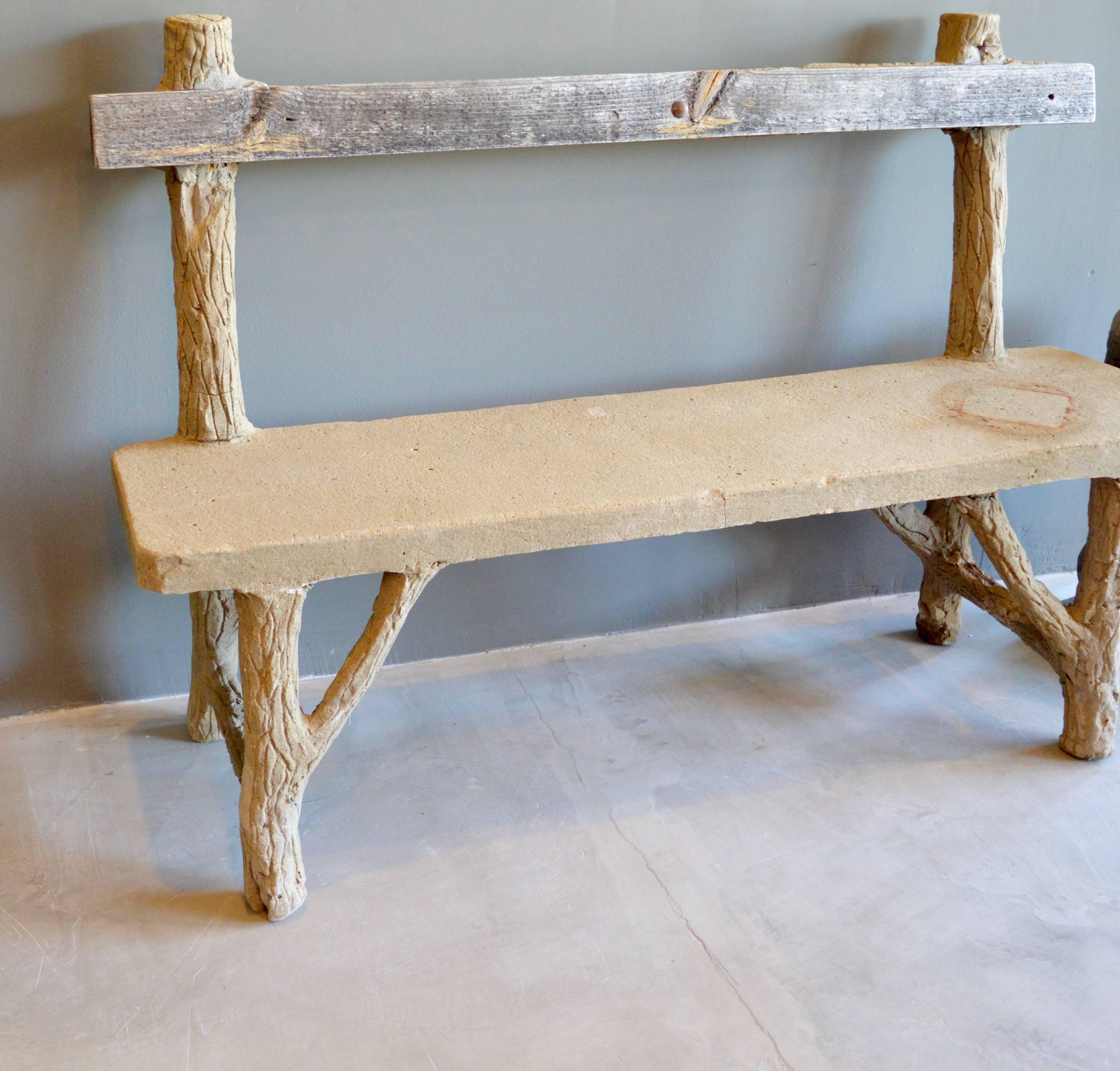 Fantastic concrete Folk Art bench. Entire bench is made of concrete except one wood plank backrest. Frame simulates wood logs with a flat slab seat. Some losses throughout. Very good vintage condition. Very unique piece. Great coloring. Perfect for