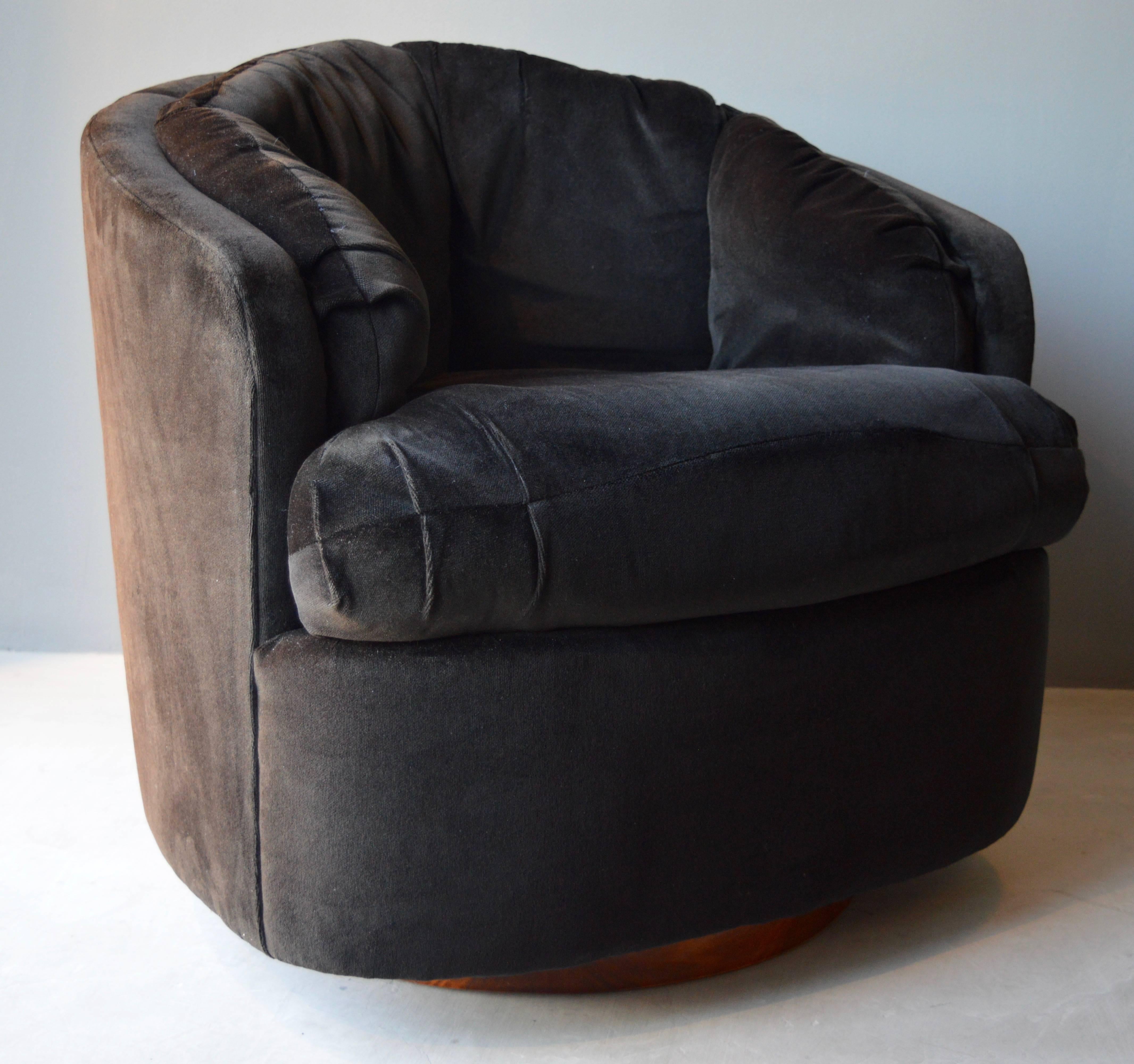 Gorgeous pair of club chairs by Milo Baughman for Thayer Coggin. Original paper label. Walnut swivel bases in excellent condition. Original black velvet upholstery. Perfect scale. COM price is 8500. Priced as is 6800.
