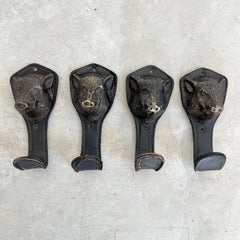 Set of 4 Adnet style Bronze and Leather Boar Head Wall Hooks, 1960s France
