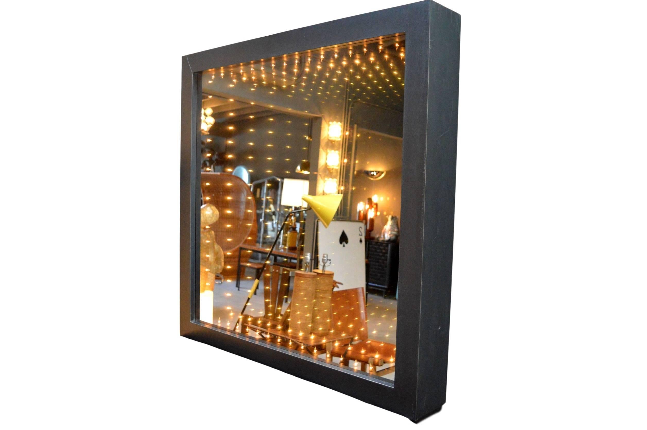 Massive vintage infinity mirror with black frame. Functions as a mirror when turned off. Great ambient background light for your home or business. Extremely rare size. Fantastic piece of wall art!