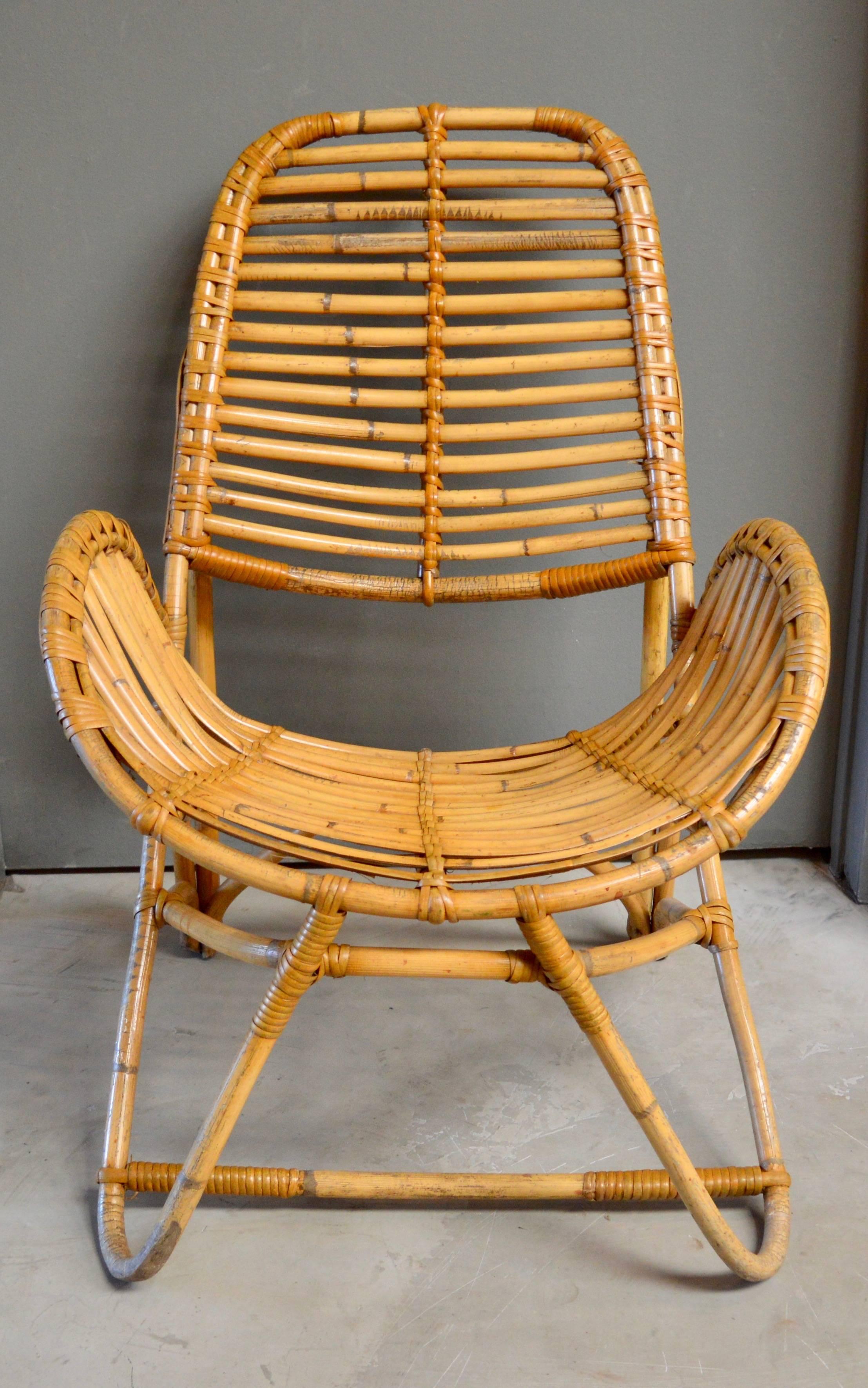 Sculptural French bamboo and rattan chair. Great lines and shape. Very comfortable. Excellent vintage condition. Perfect standalone chair.