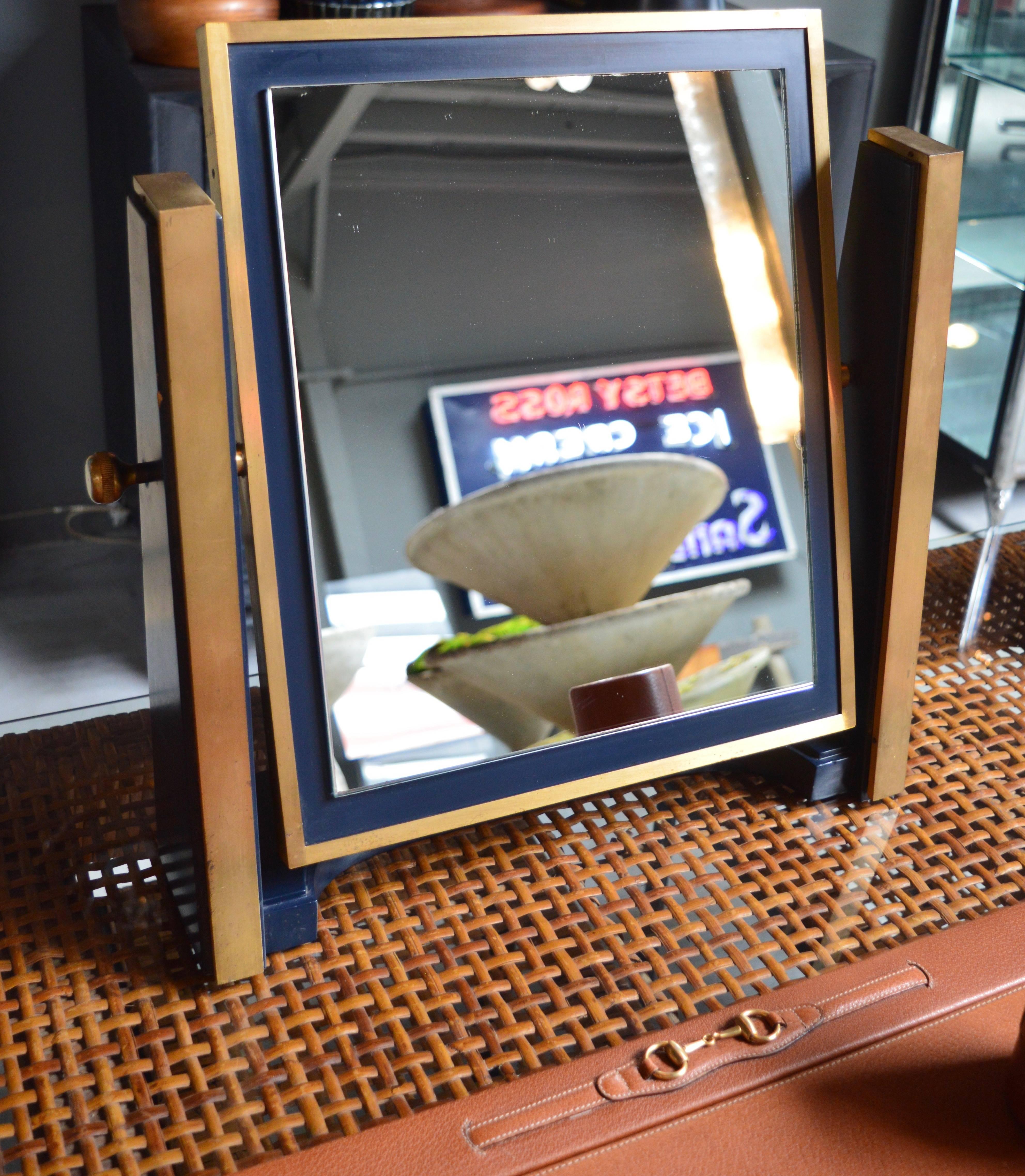 Stunning Italian tabletop mirror made of lacquered wood and brushed brass. Excellent vintage condition. Large-scale Very unique piece.