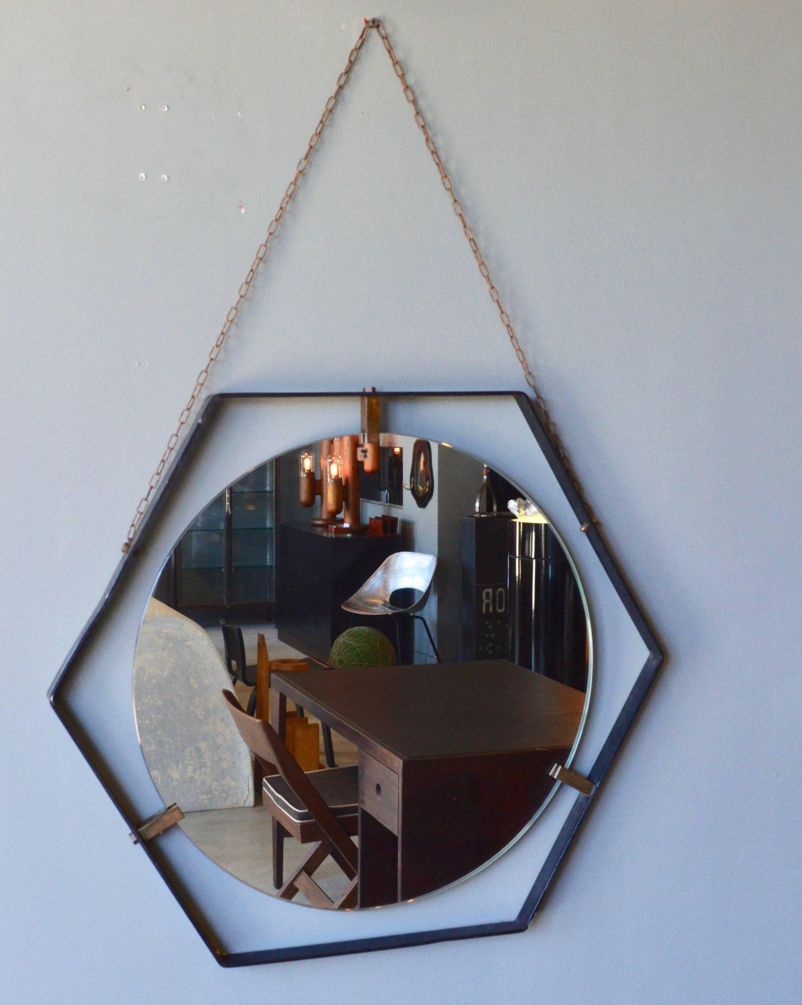 Sculptural vintage Italian floating mirror suspended from metal chain. Made in the 1960s. Only one available. Excellent vintage condition. Similar round and ovular mirrors available in separate listings.