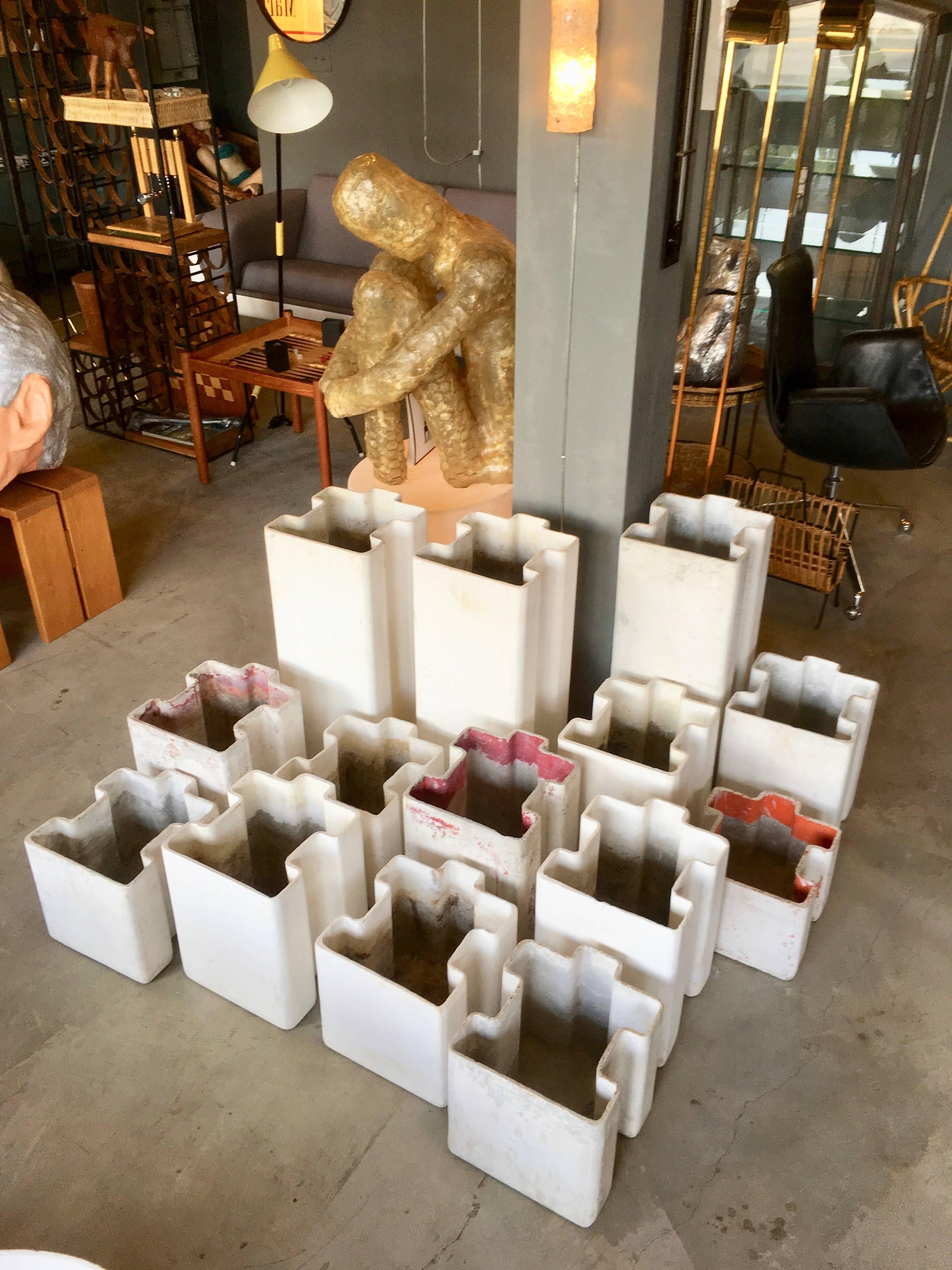 Fantastic piece of sculpture by Swiss architect Willy Guhl. 14 concrete planters in the shape of jigsaw puzzle pieces. Fantastic sculptural piece for indoors or outside. Succulents included. Sold as a set. Great standalone piece of art. Modular and