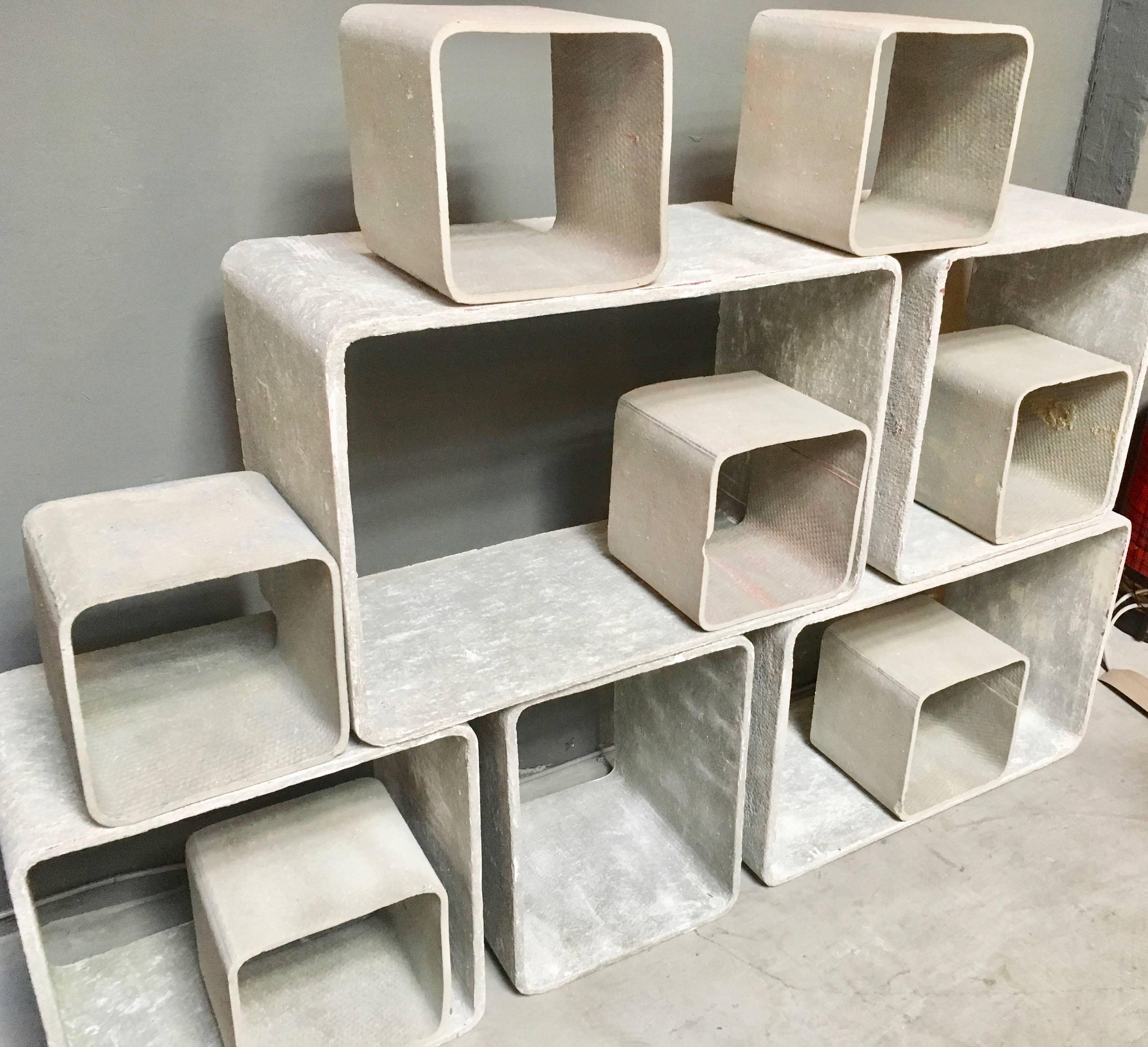 Collection of twelve concrete cubes by Swiss Designer Willy Guhl. Original concrete color. Able to be stacked in any direction. Great modular bookcase and sculpture. Excellent vintage condition.

Can be used indoors or outside.

Dimensions vary