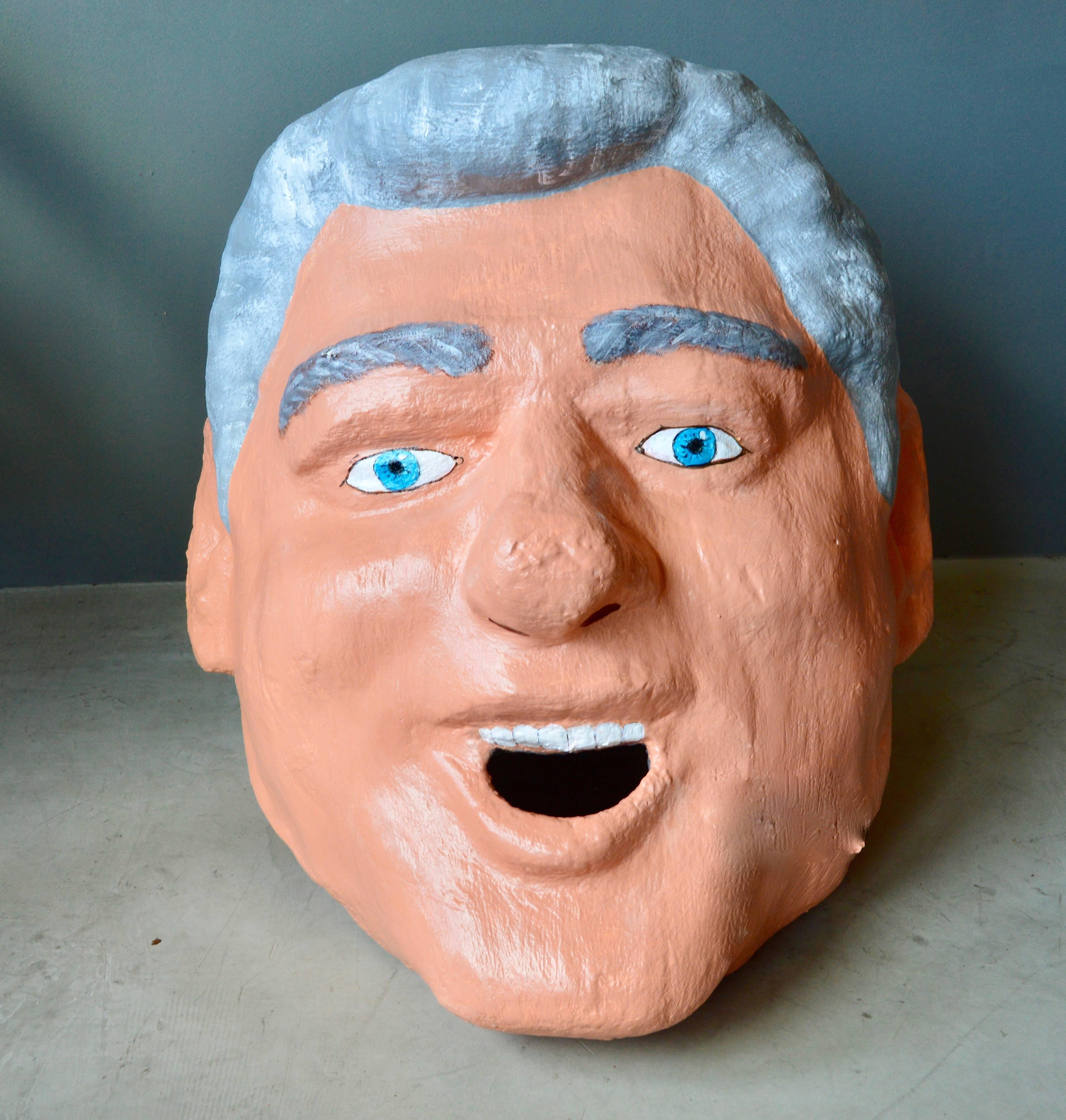 Monumental sculptural head of President Bill Clinton. Made out of foam, paste and hand-painted. Able to be worn on the head. Looks great as a free floating sculpture. Kennedy and George Bush also available. Very unique object.