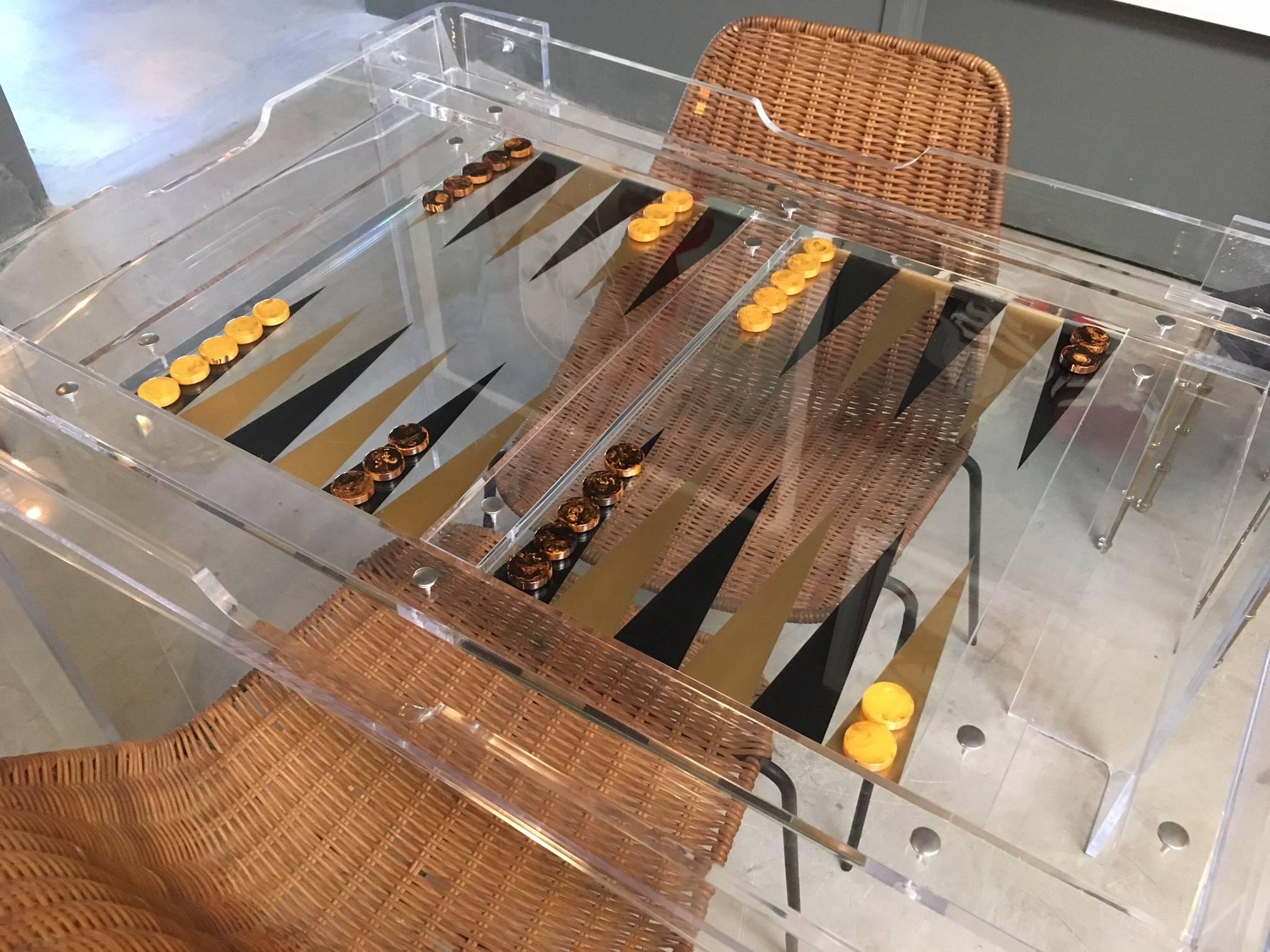 Gorgeous Lucite backgammon table with glass chessboard removable top. Very good vintage condition. Vintage backgammon pieces included in sale. Fantastic design and perfect scale.
