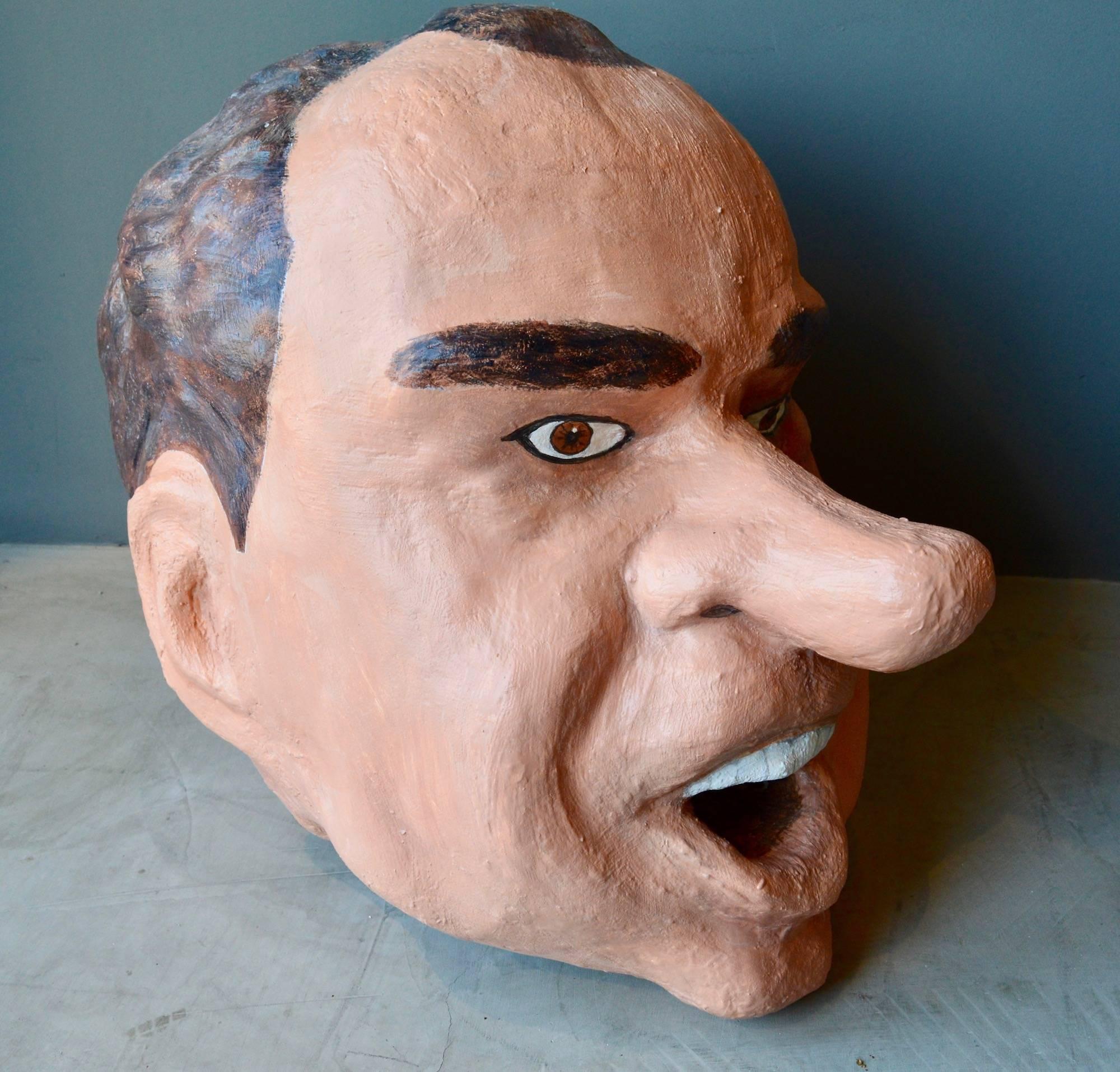 Monumental sculptural head of President Richard Nixon. Made out of foam, paste and hand-painted. Able to be worn on the head. Looks great as a free floating sculpture. Presidents Clinton, Kennedy and George Bush also available. Very unique object.