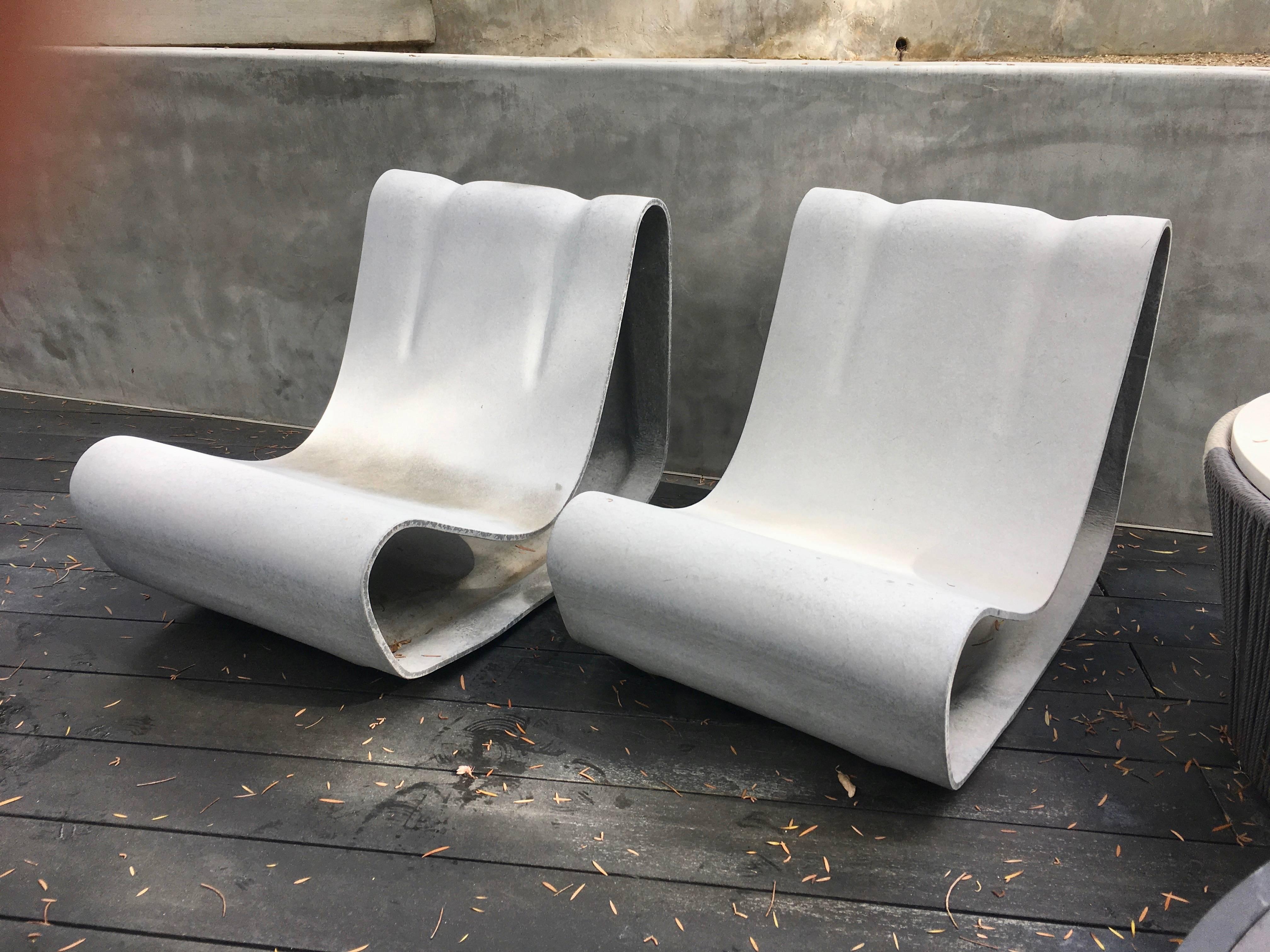 Fantastic pair of cement chairs by Swiss designer Willy Guhl for Eternit. Brand new. Hand made in Switzerland,. Newly produced. Priced as a pair. One of the most iconic chairs ever designed. 
