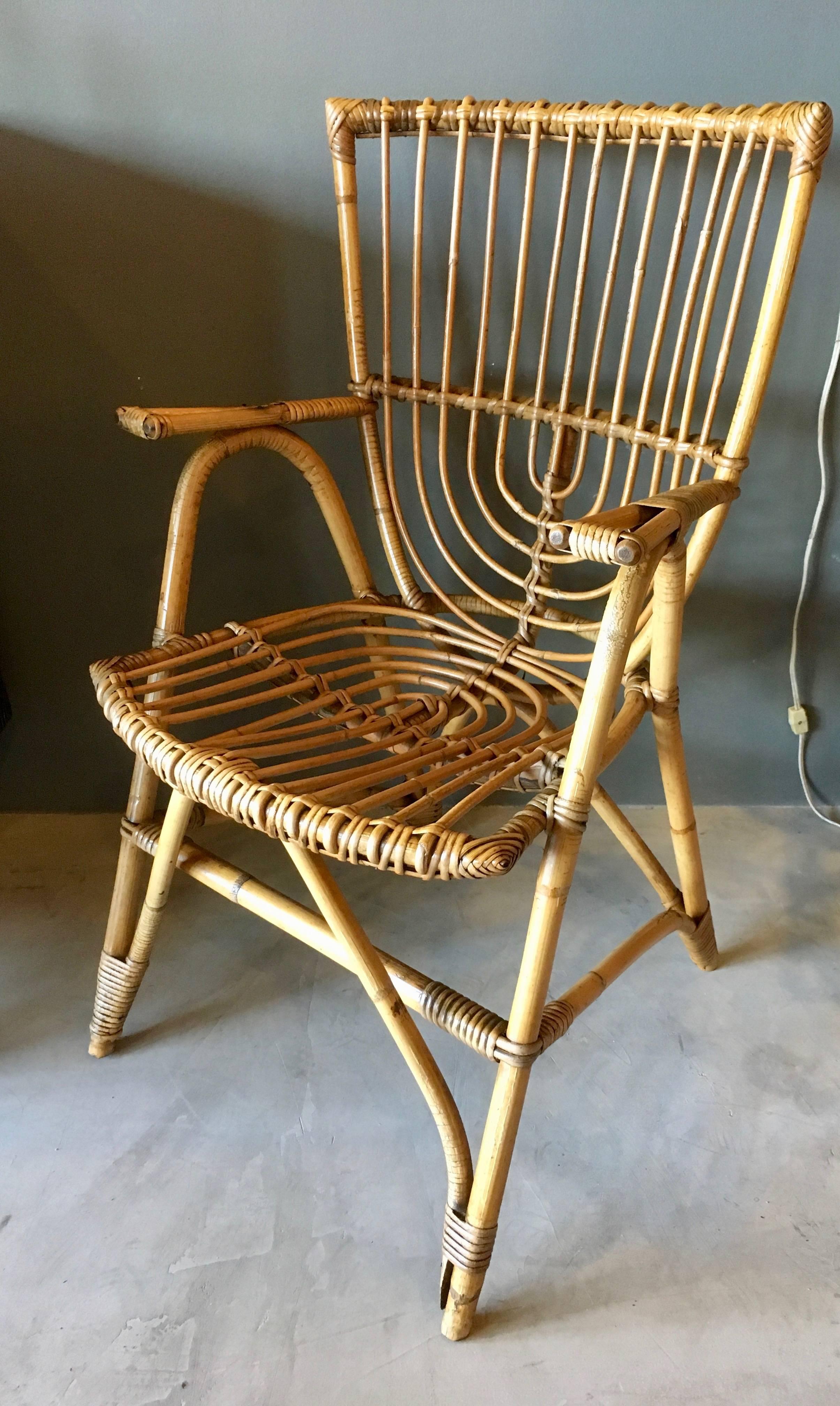Gorgeous pair of sculptural French rattan and bamboo armchairs. Great vintage condition and coloring. Good lines.