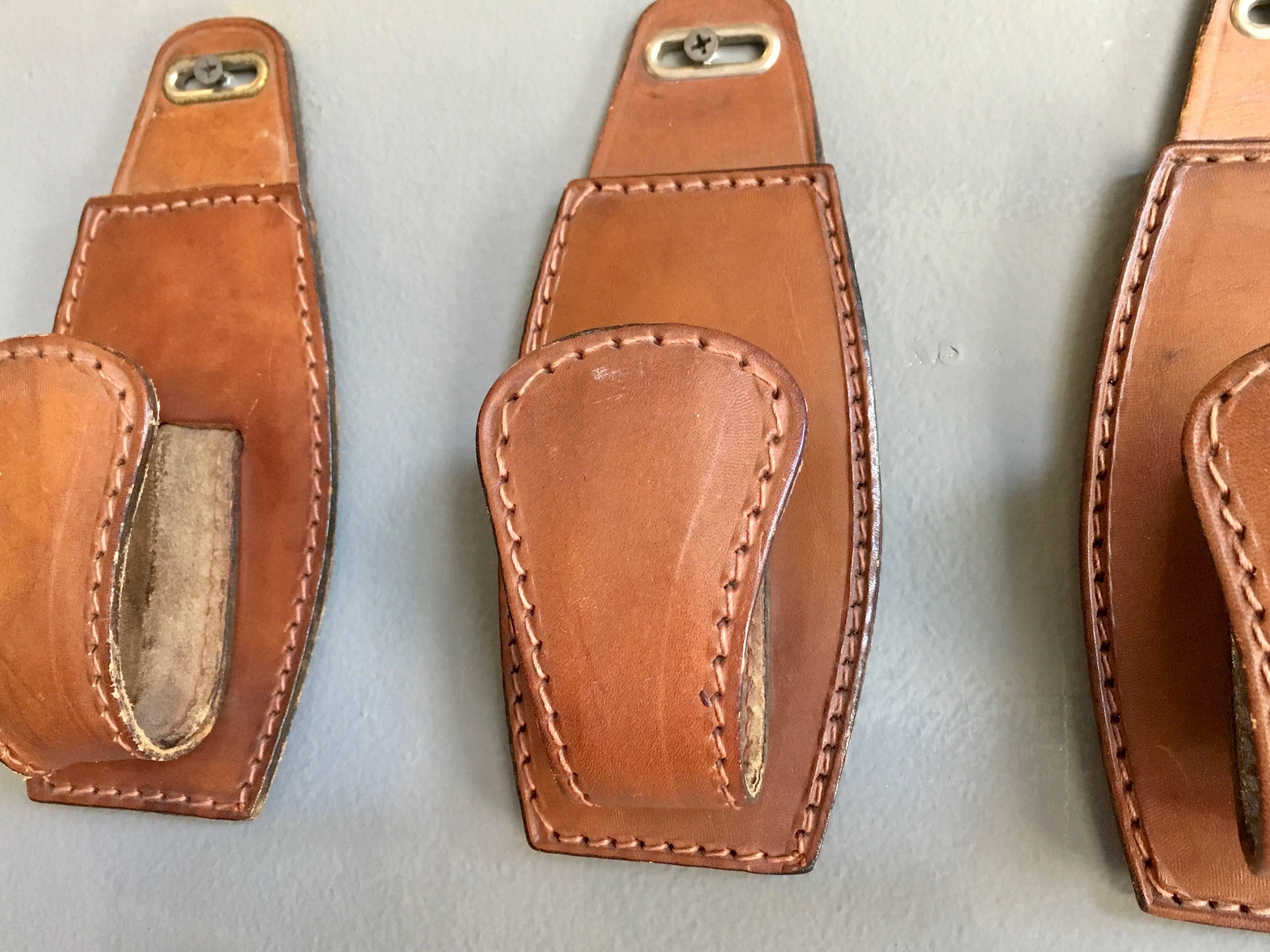 Mid-20th Century Set of Four Adnet Style Saddle Leather Hooks