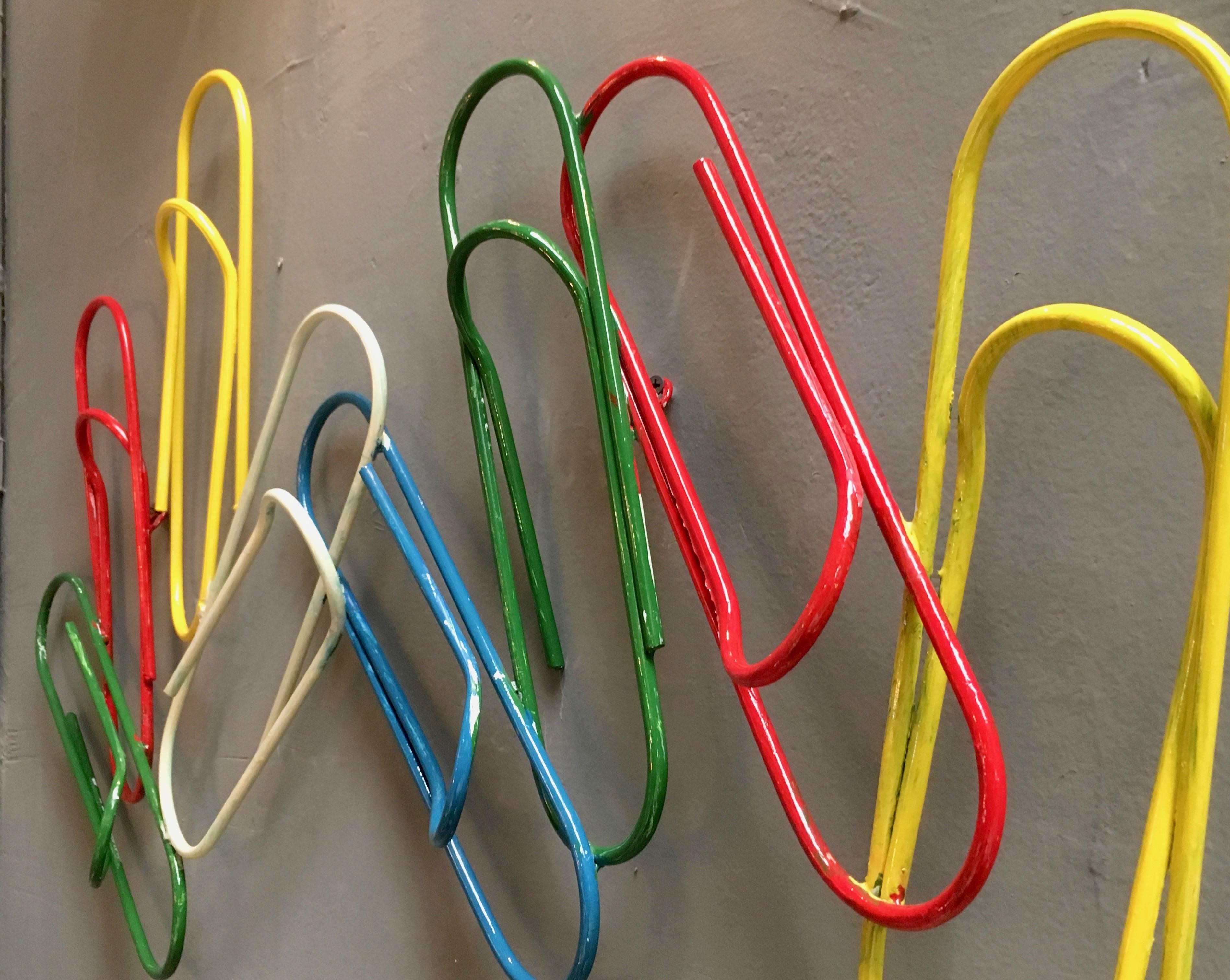3 foot long metal coat rack of oversized paperclips from France. Eight painted paperclips soldered together. Very fun piece of art. Great piece of usable pop art.
