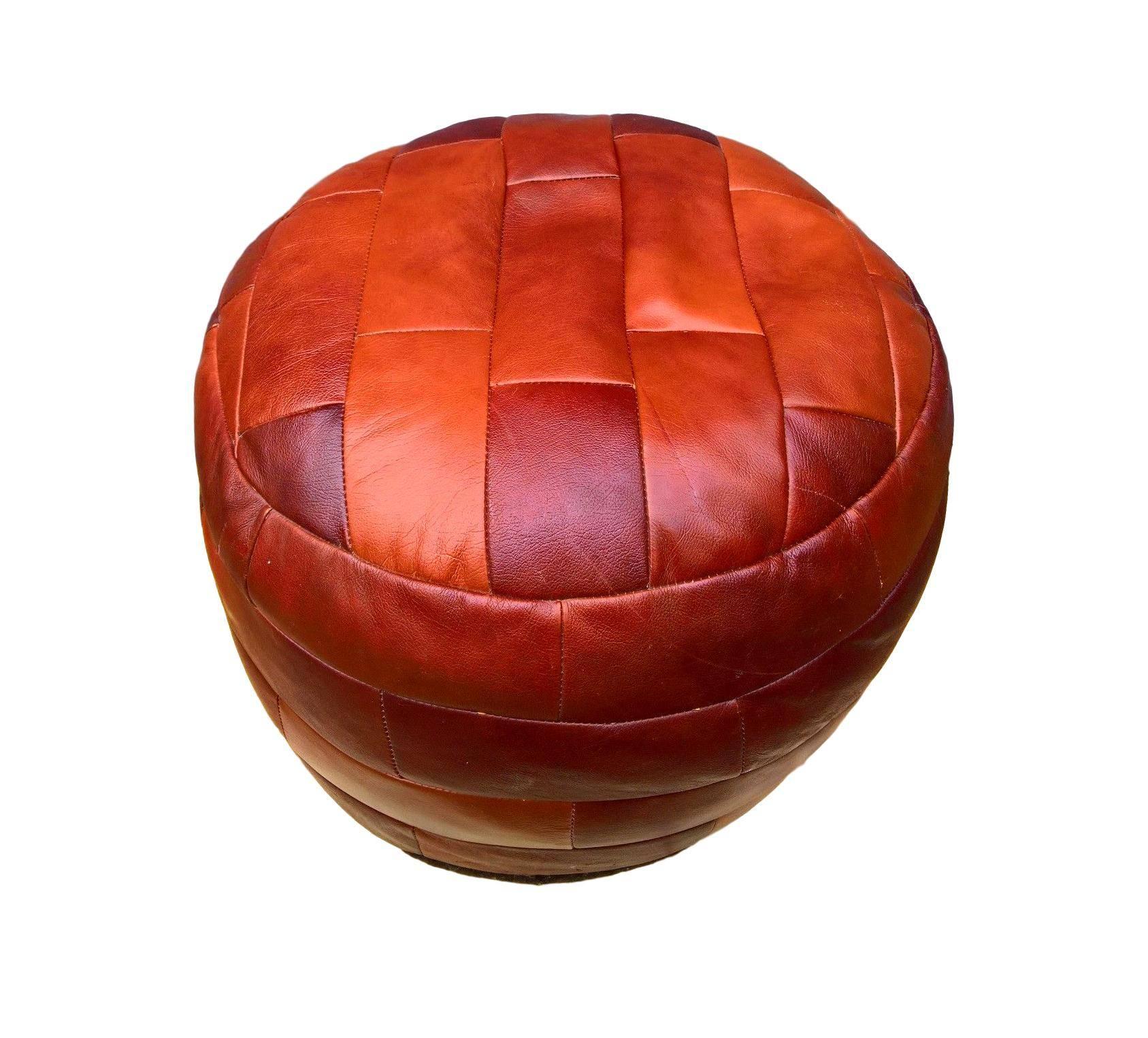 Gorgeous patchwork leather pouf by De Sede. Great cognac coloring and great patina to leather. Excellent condition.

Similar light tan De Sede patchwork pouf available in separate listing.