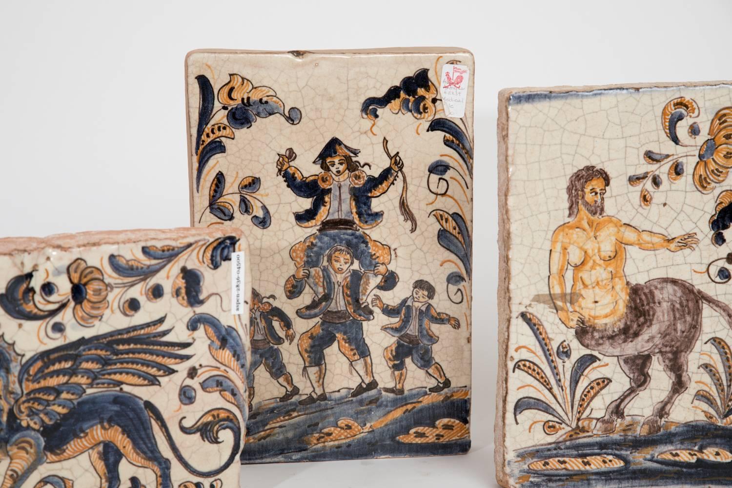 A collection of five (sold individually) antique Spanish tiles.