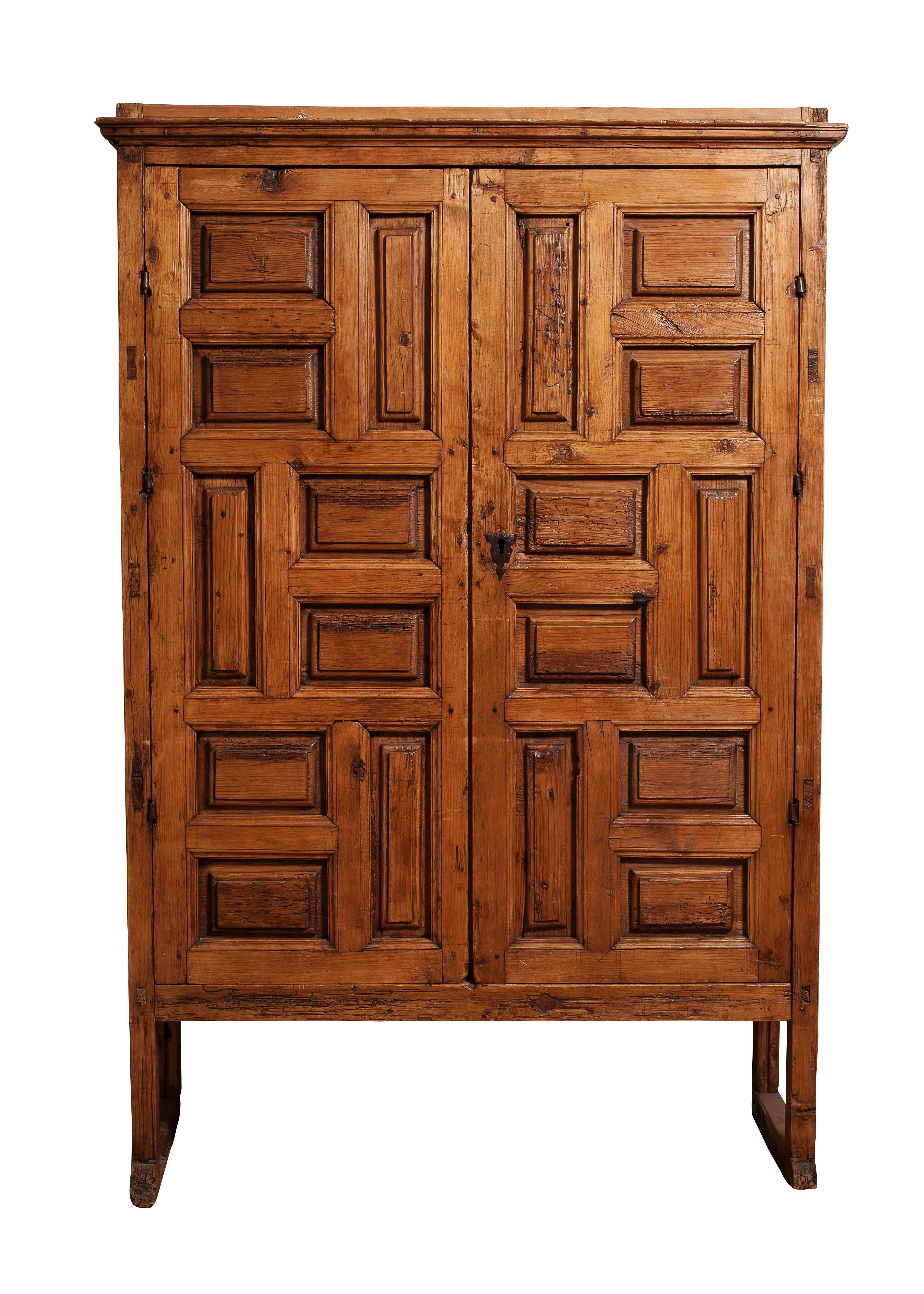 18th century Mexican carved pine armoire. Beautiful, masculine character and aged to perfection.