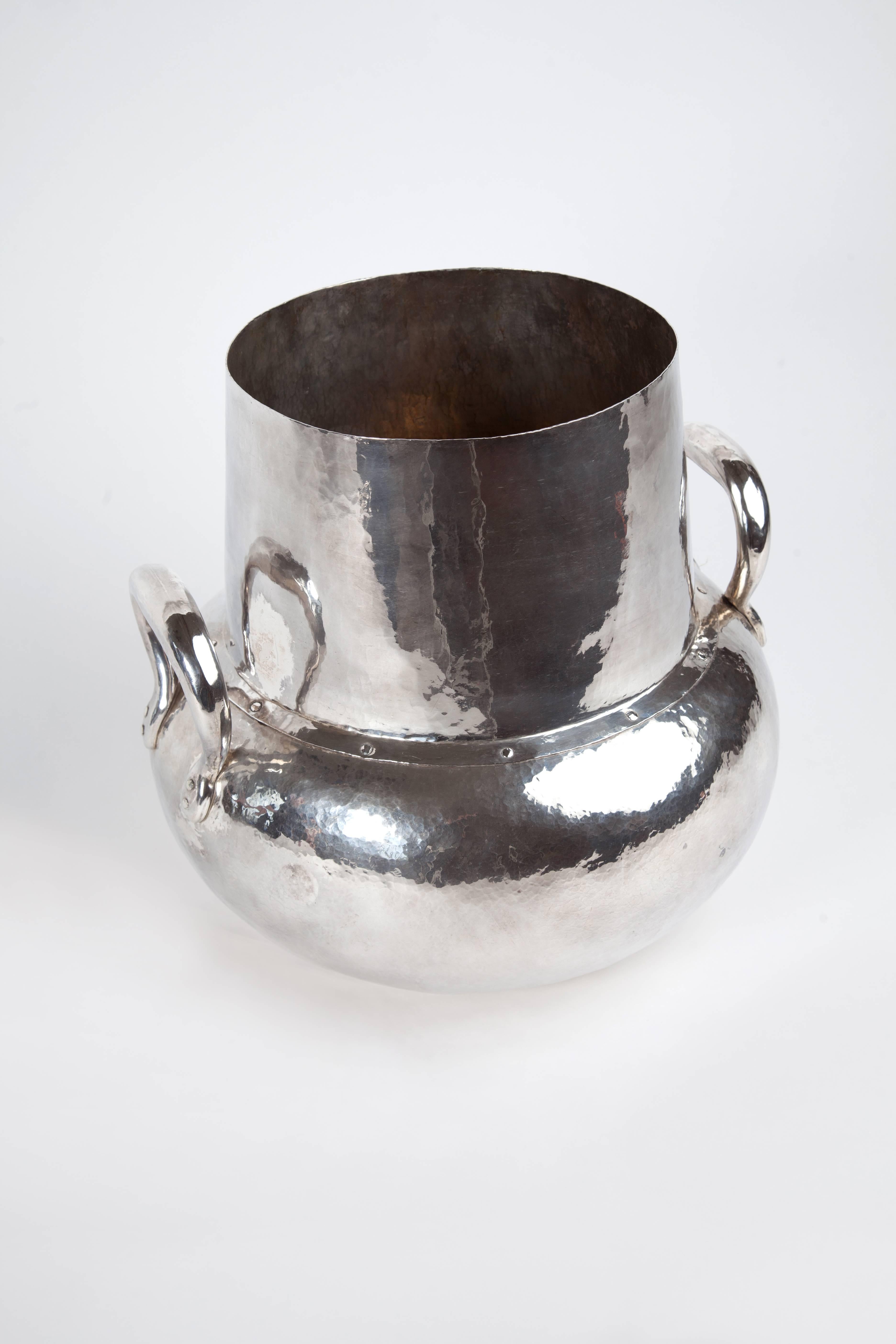 Large sterling silver hand-hammered Olla with two handles. This is a one of a kind piece from Bolivia.
