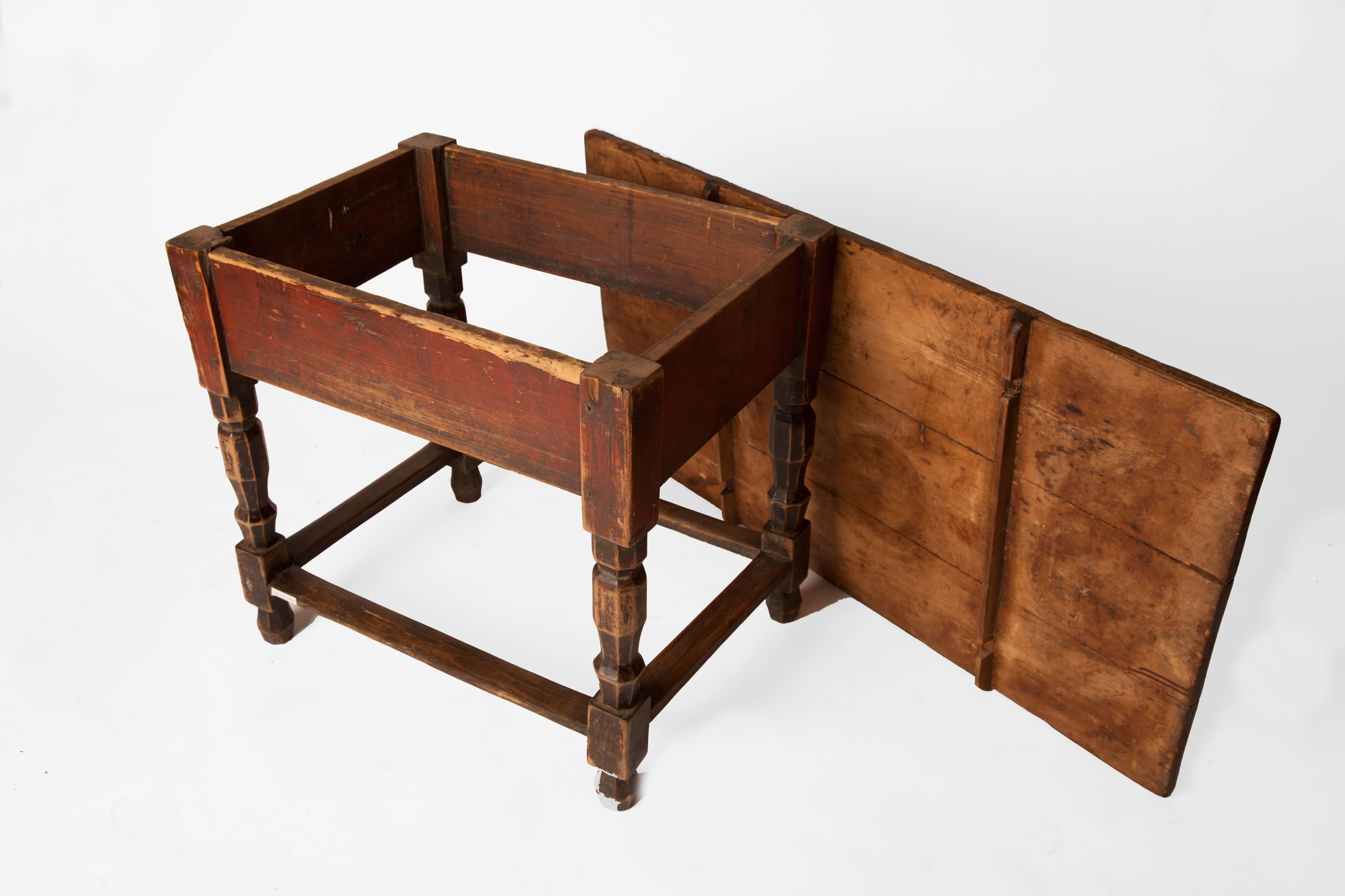 Charming low table, with red painted base and interesting carved legs. The top comes off so it's easily movable. Great as a side table or as a unique coffee table.