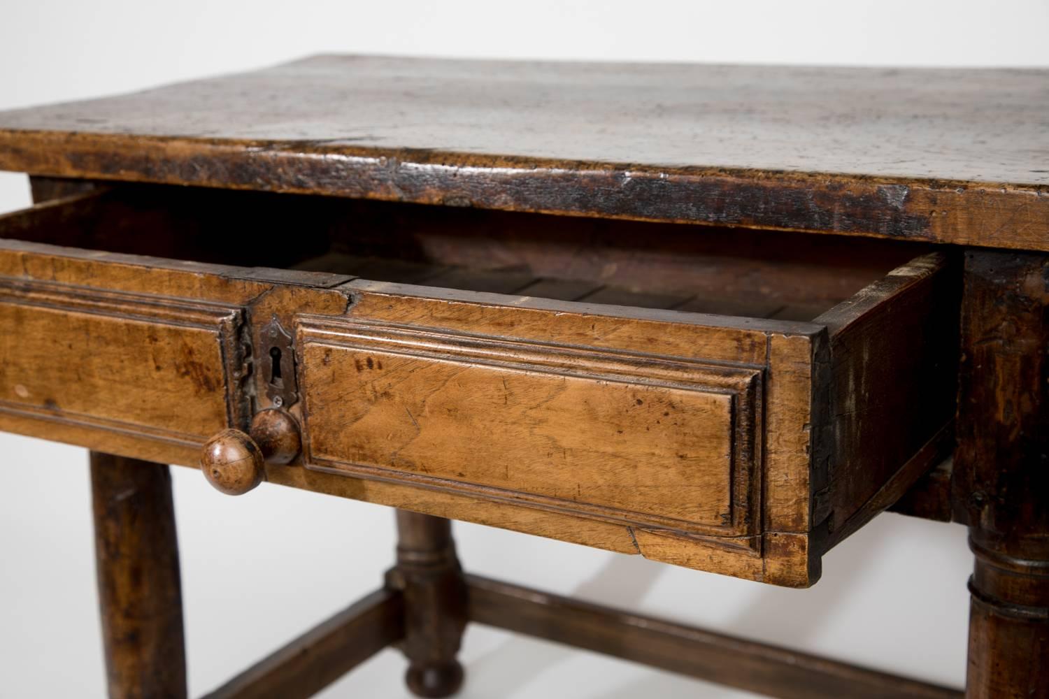 Lovely rustic walnut low table with one drawer, English, 18th century.