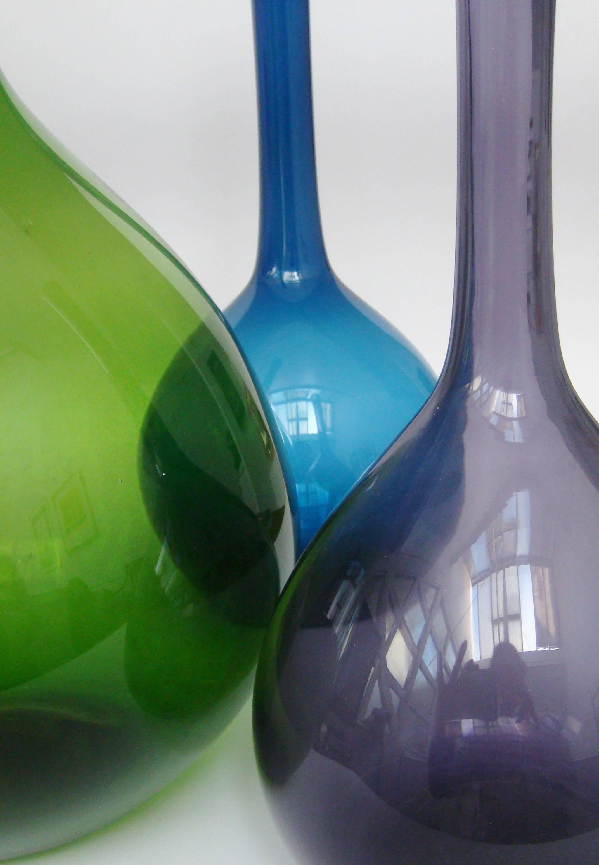 A set of three blomglas vases designed by Arthur Percy for Gullaskruf.

Measure:Green height 49.5 cm.
Sapphire height 40 cm.
Amethyst height 33 cm.

Can be sold indiviually.